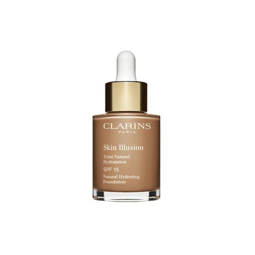 Clarins Skin Illusion Foundation. Braune Flüssigkeit in Glasflasche mit goldener Kappe und Pipette. SPF 15.