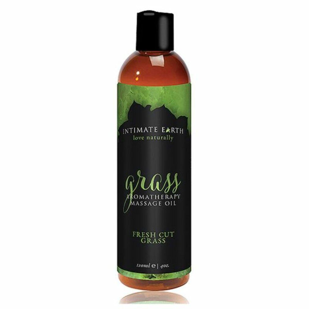 Flasche Intimate Earth Grass Massageöl. Schwarzes Etikett mit grünen Blättern und Schriftzug. 120ml.
