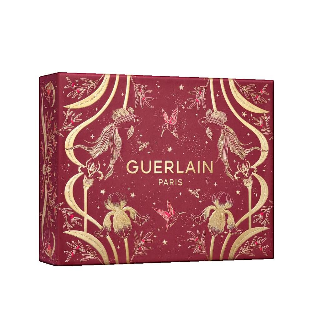 Rote Geschenkbox mit goldenen Verzierungen. Aufschrift: GUERLAIN PARIS. Verzierungen: Fische, Blumen, Vögel. Rechteckige Form.