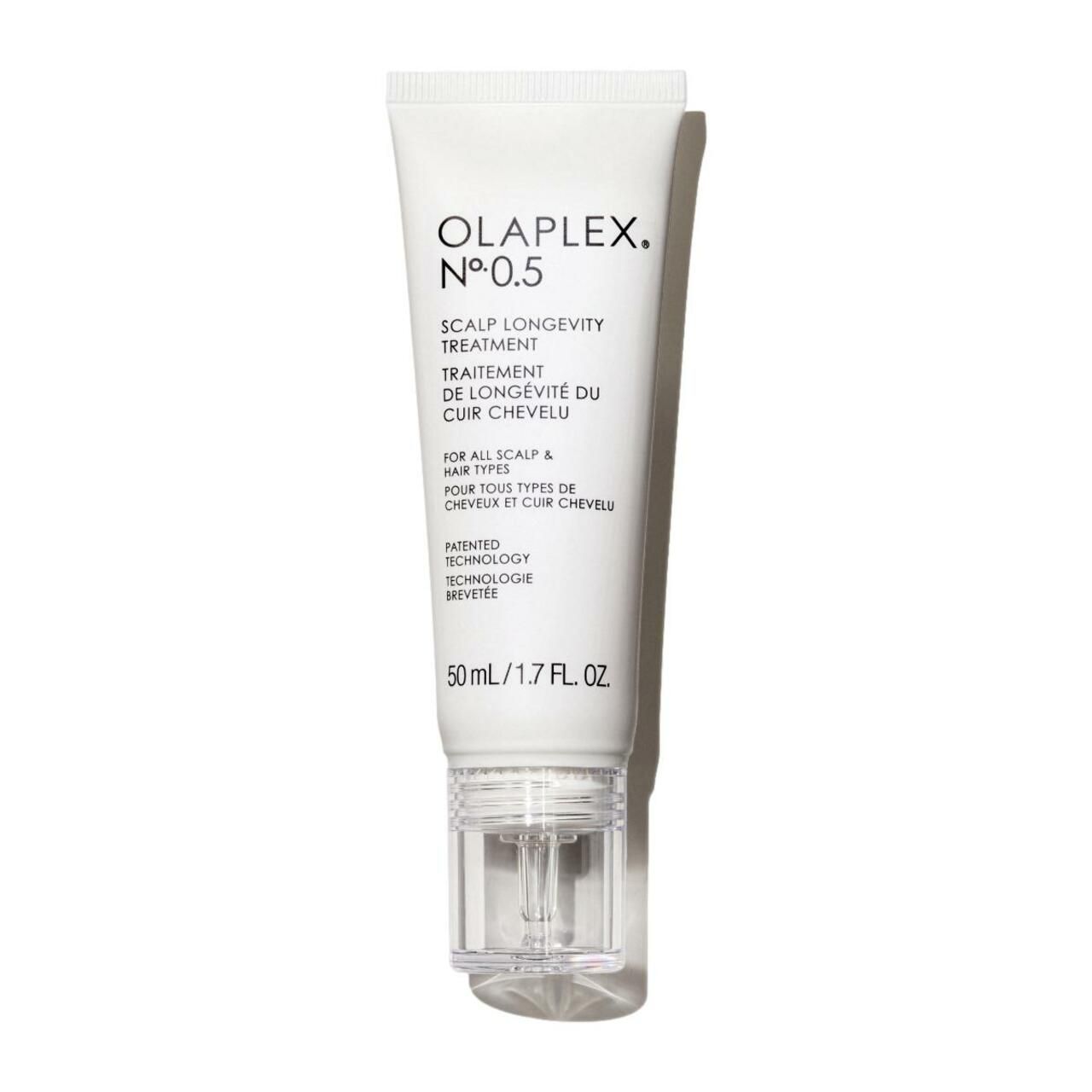 Weiße Tube mit Produktbezeichnung und Text. Klare, transparente Applikatorspitze. 50 ml/1.7 FL. OZ.