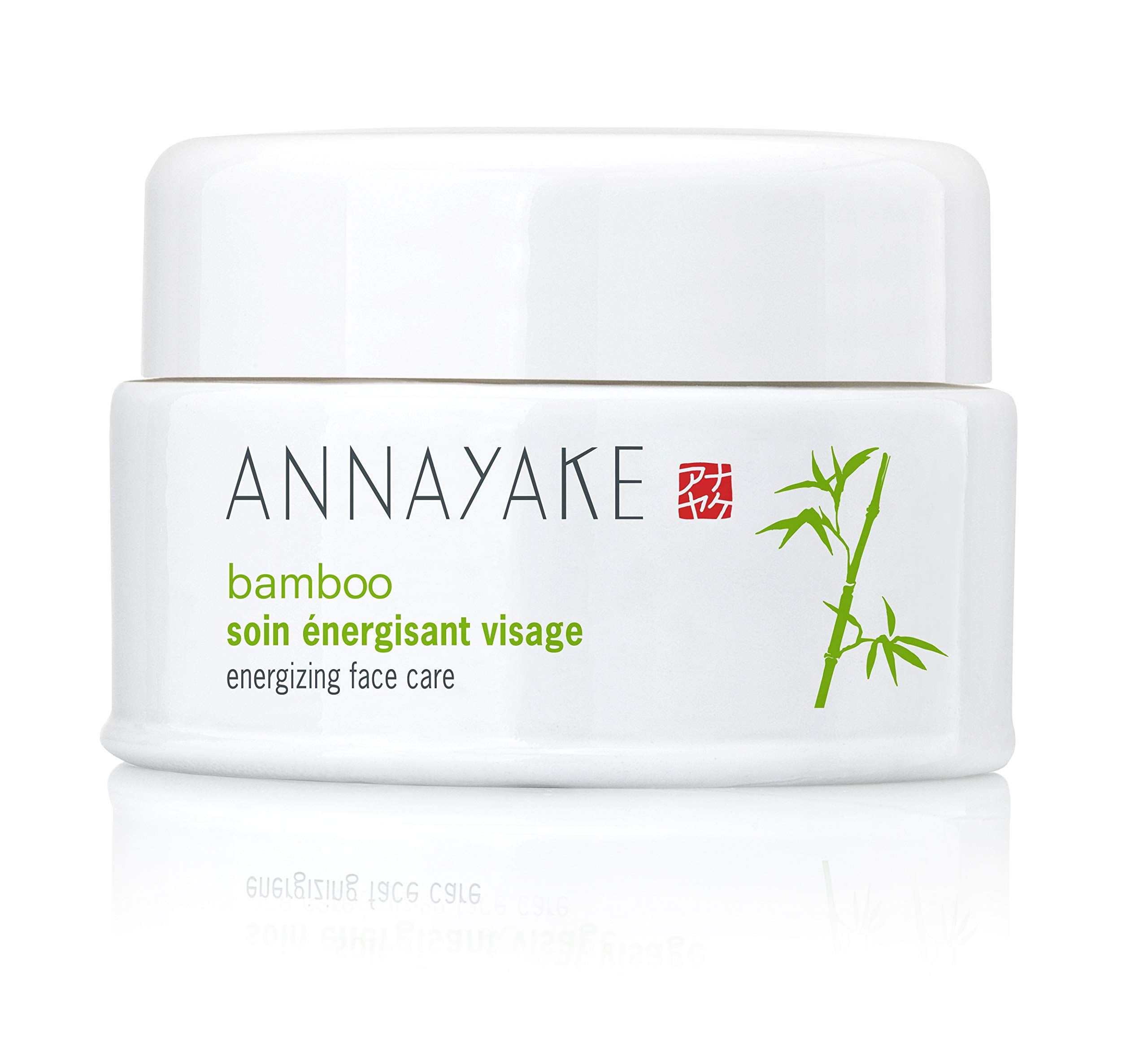 Weißer Tiegel mit Deckel. Aufschrift: ANNAYAKE, bamboo, soin énergisant visage, energizing face care. Logo und Bambus-Illustration.