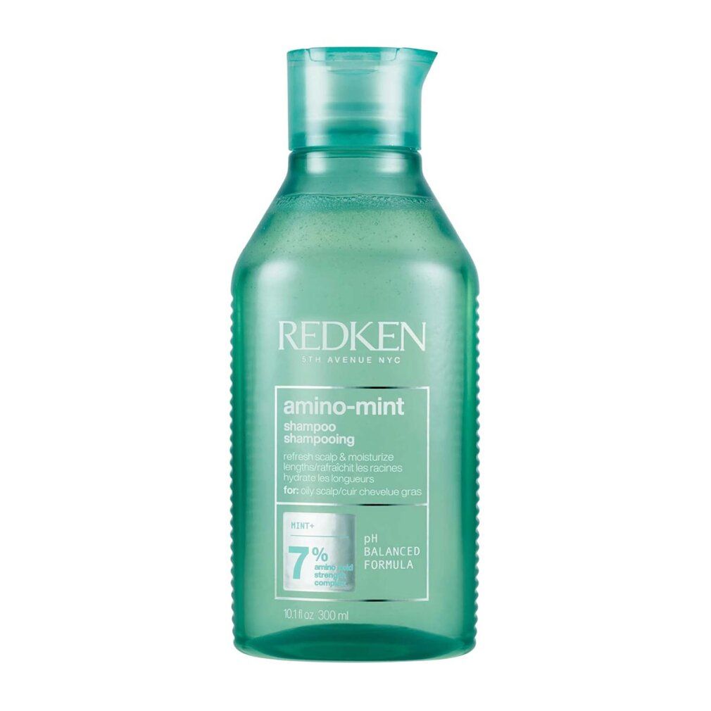 Grüne Redken Amino Mint Shampoo Flasche. Enthält Text: Shampoo, pH-ausgewogene Formel, 7%.