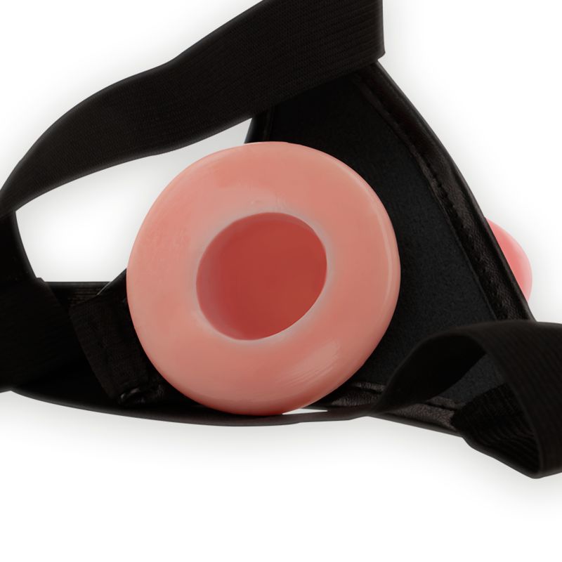 Nahaufnahme eines Penis-Aufsatzes. Der Aufsatz ist rosa und hat ein Loch in der Mitte.