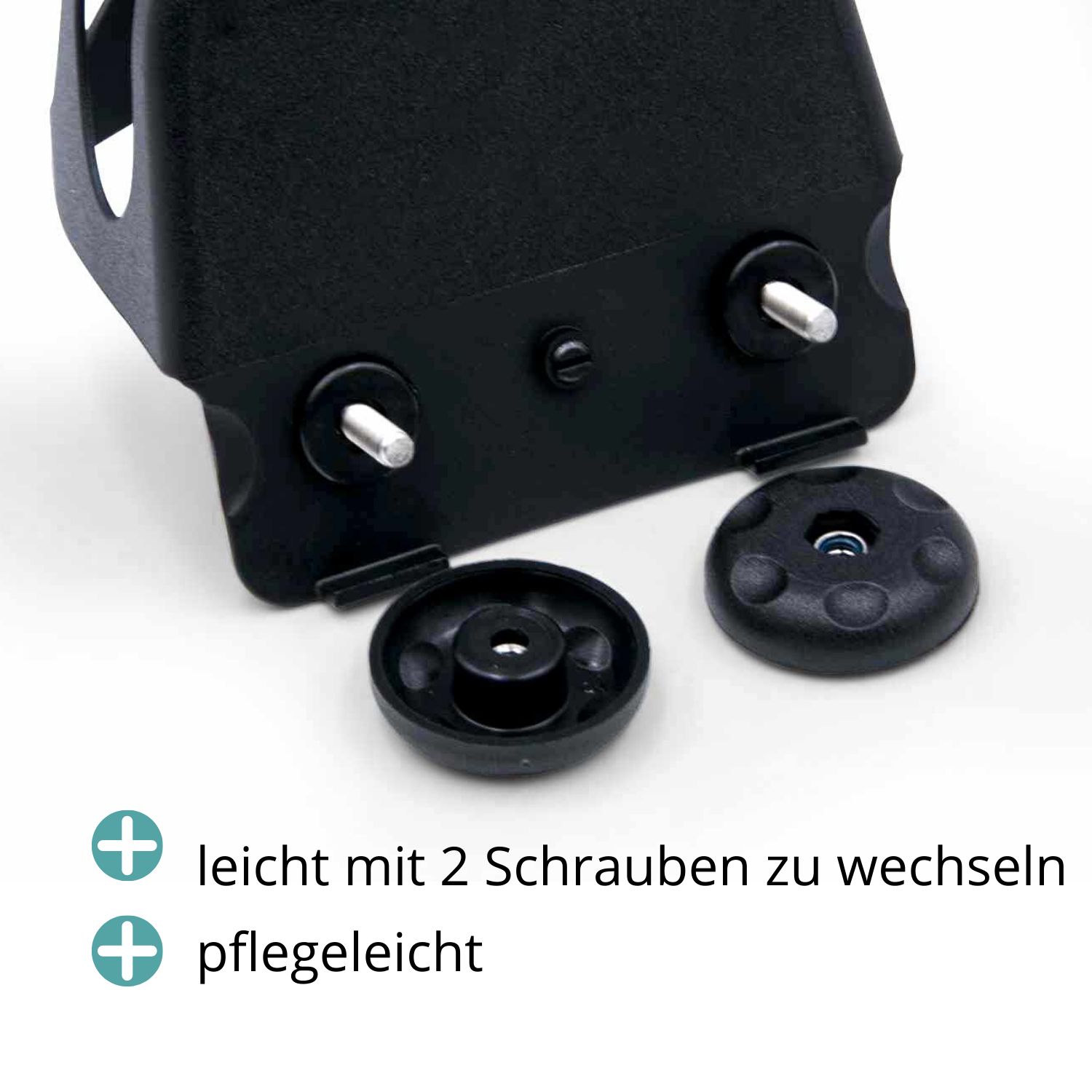 Nahaufnahme von schwarzen Steigbügeleinlagen. Zwei Schrauben und zwei runde Kappen. Einfacher Austausch.