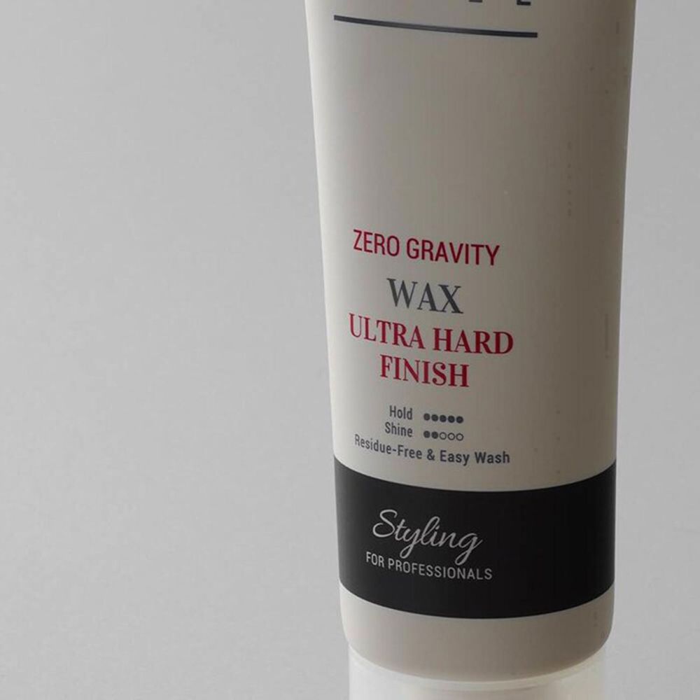 CURLY SHYLL Zero Gravity Wax Tube. Beige Tube mit schwarzem Text. Produkt: Ultra Hard Finish, Styling for Professionals.