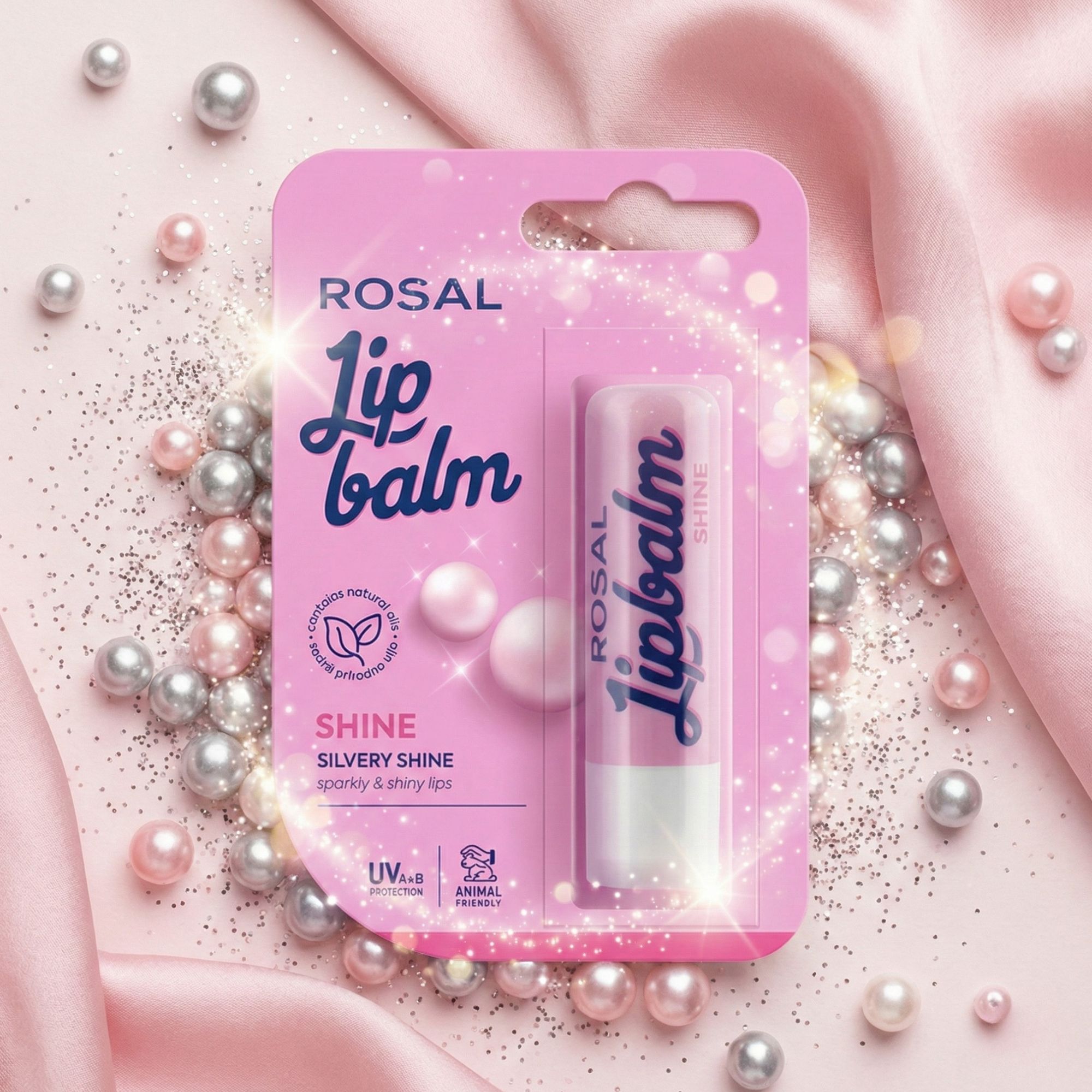 Rosa Verpackung mit Lip Balm. Text: ROSAL, Lip balm, Shine, Silvery Shine, UV-Schutz, tierversuchsfrei. Glitzer und Perlen.