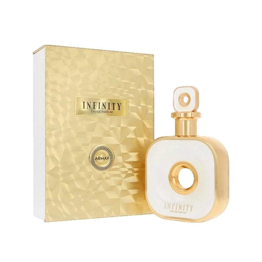 Parfümflakon und Verpackung. Weißes, quadratisches Fläschchen mit goldenen Akzenten und einem Loch in der Mitte. Goldene Verpackung.