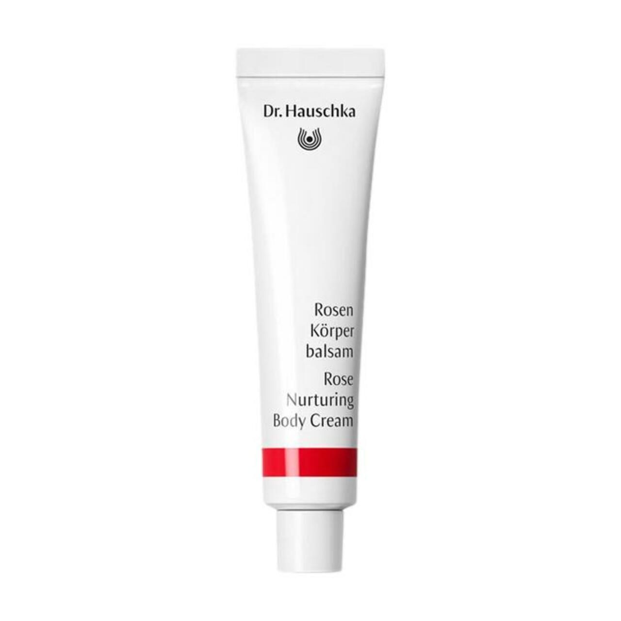 Körperbalsam-Tube. Weiß mit rotem Streifen. Schriftzug: Dr. Hauschka, Rosen Körperbalsam, Rose Nurturing Body Cream.