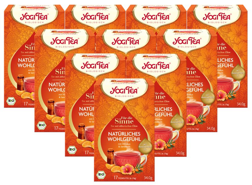 Mehrere Packungen Yogi Tea, orangefarbene Verpackung. Aufdruck: Yogi Tea, Natürliches Wohlgefühl, Bio-Kräutertee. 17 Beutel.