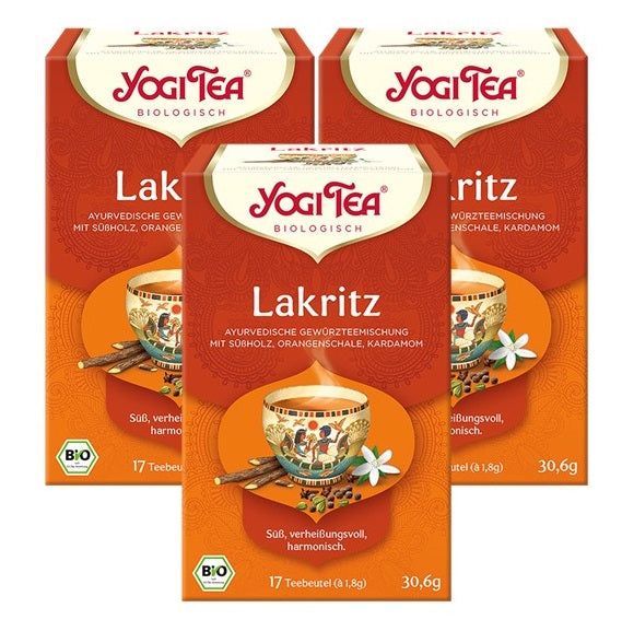 Drei Packungen Yogi Tea Lakritz Bio Gewürztee. Orangefarbene Verpackung mit Logo und Produktbezeichnung. Bio-Siegel.