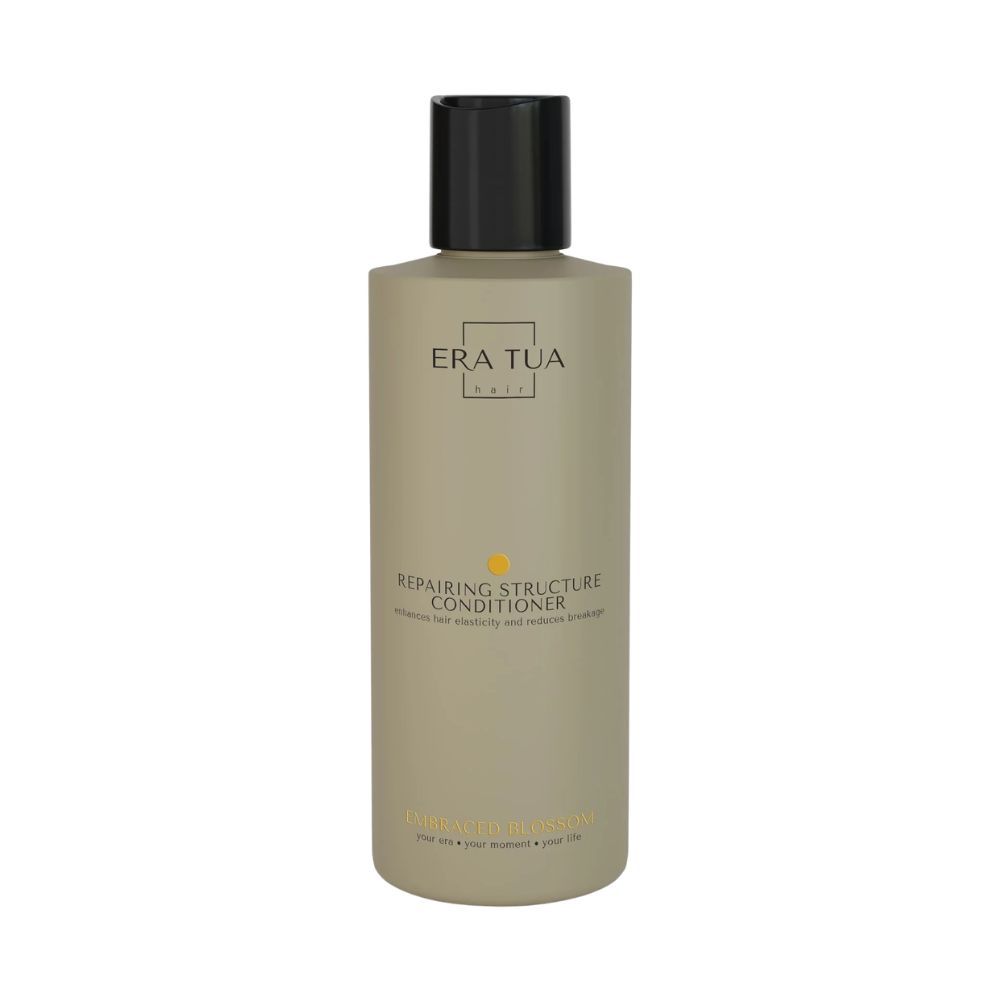 Flasche mit Conditioner, Text: ERA TUA, Repairing Structure Conditioner. Gelbe Punkte.