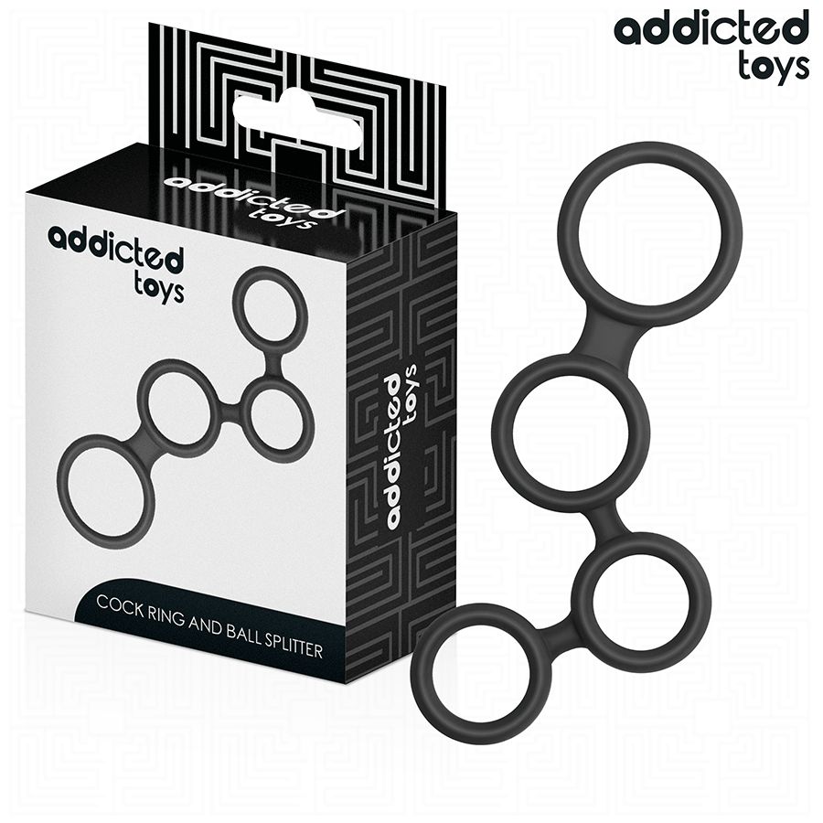 Schwarzer Penisring mit Hodenteilern, neben Verpackung. Verpackung mit Markenlogo und Produktbezeichnung.