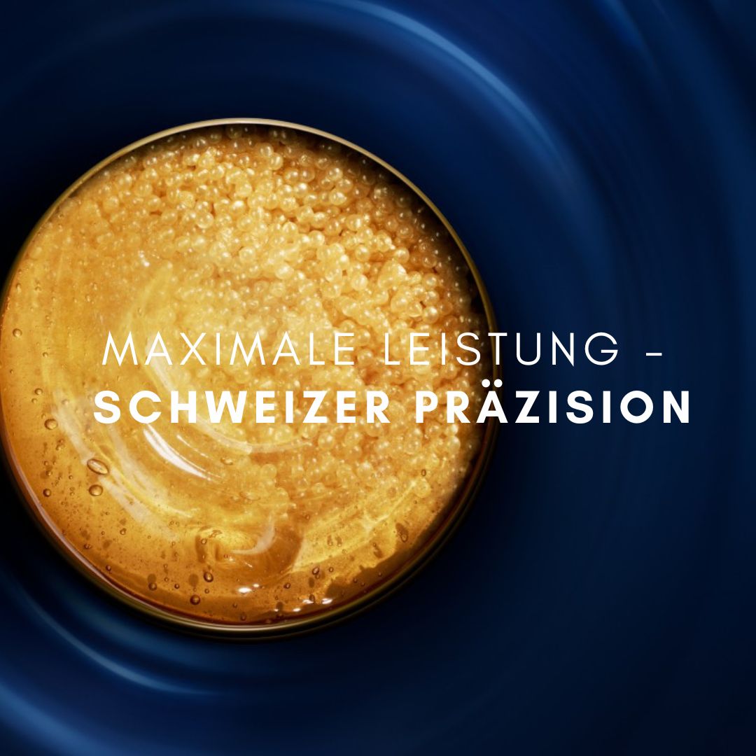 Text: MAXIMALE LEISTUNG - SCHWEIZER PRÄZISION. Goldene Flüssigkeit auf blauem Hintergrund.