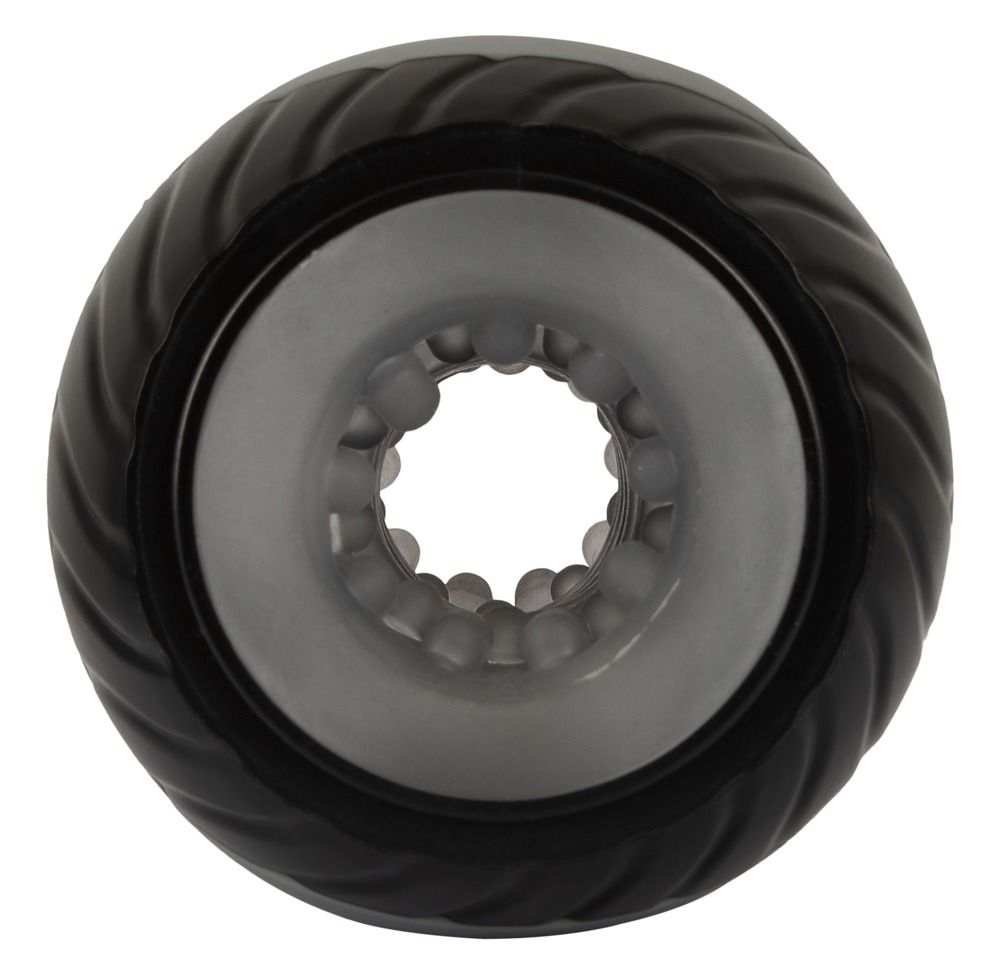 Zylindrisches Produkt mit gewellter Oberfläche. Innenraum mit Noppen sichtbar. Schwarzer Rand.