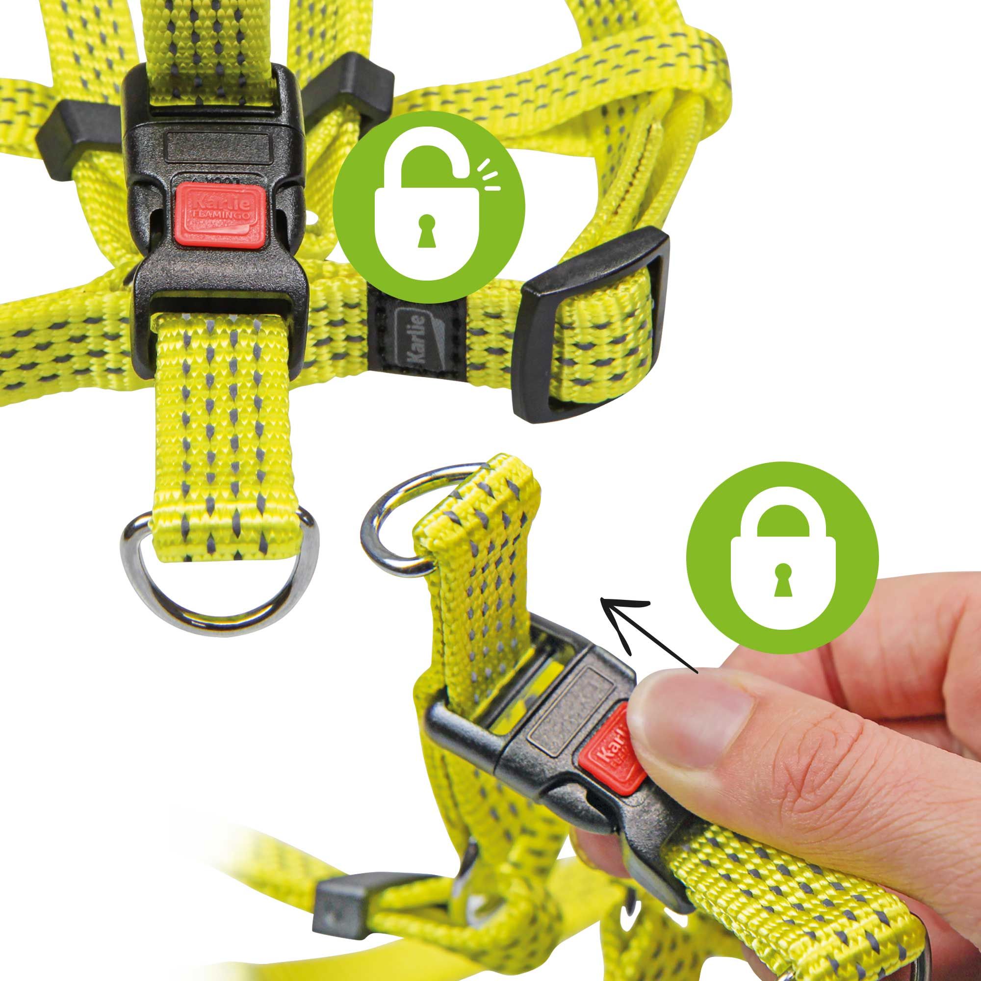 Detailansicht eines gelben Hundegeschirrs. Schwarze Schnallen mit rotem Knopf. Schloss-Symbol.