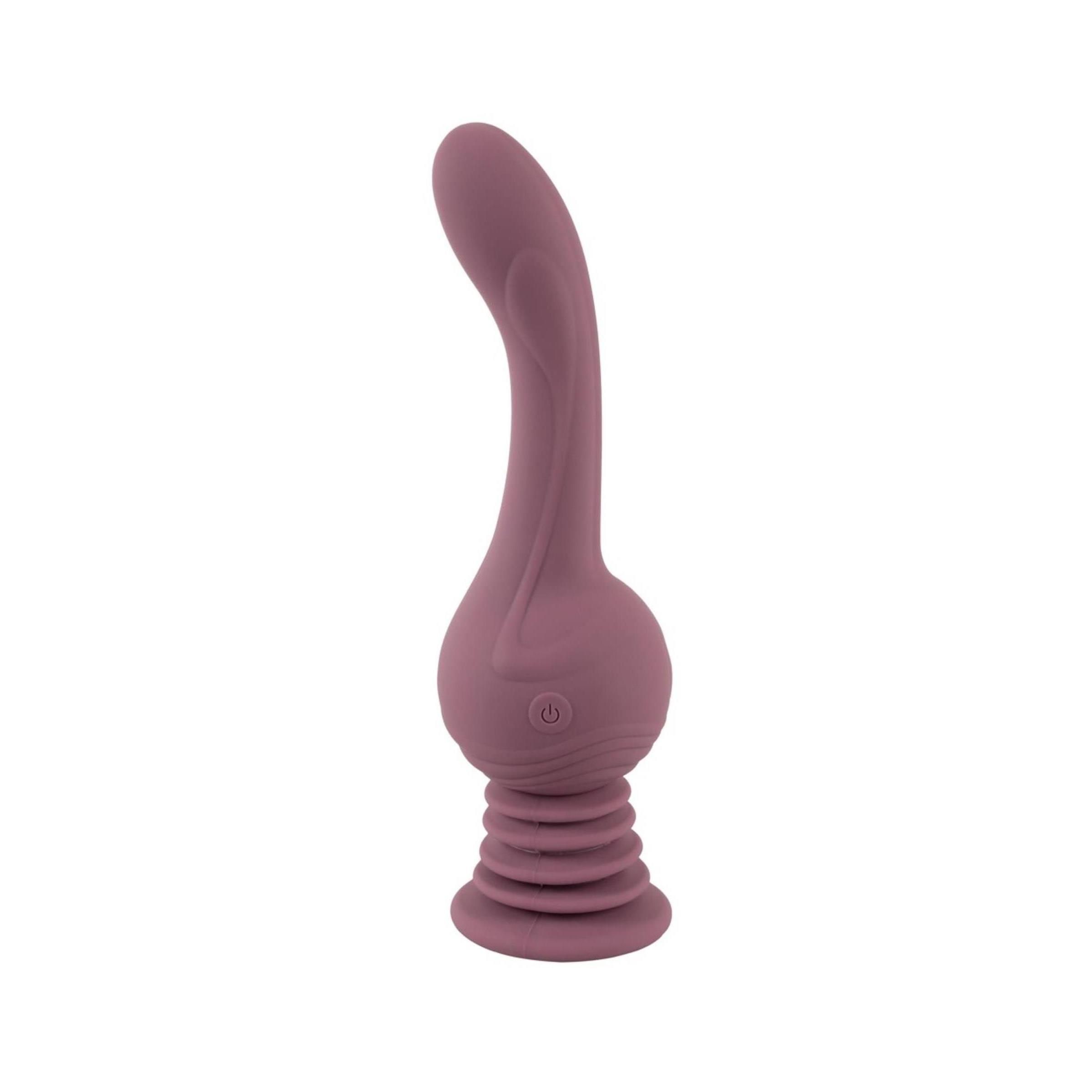 Lila Vibrator mit geriffelter Basis und geschwungener Form. Vertikale Ausrichtung, vor weißem Hintergrund.