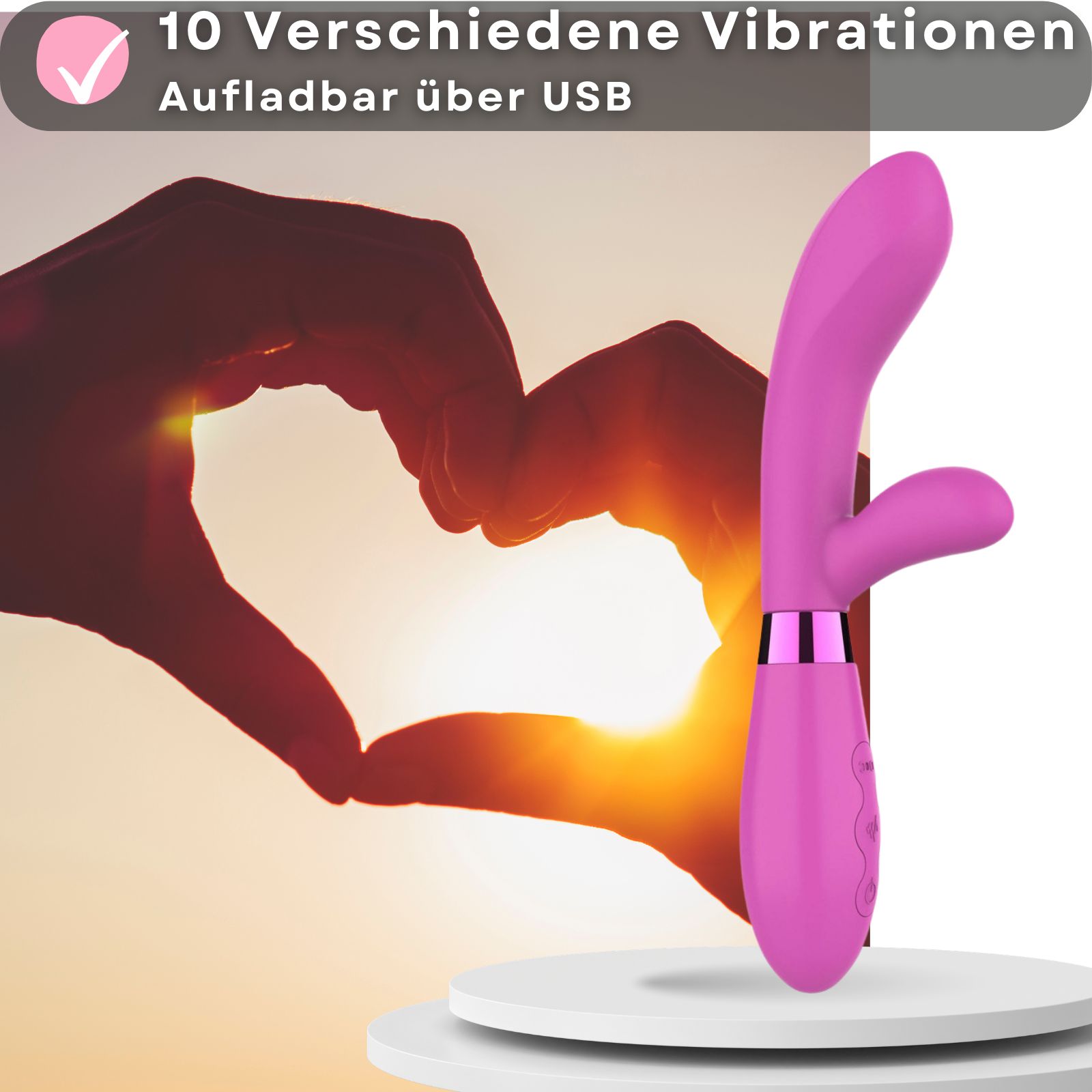 Rosa Vibrator, Silikon und ABS. 10 Vibrationsmodi. USB-aufladbar. Paar im Hintergrund. Auf Podest. 20cm, 3,5cm.