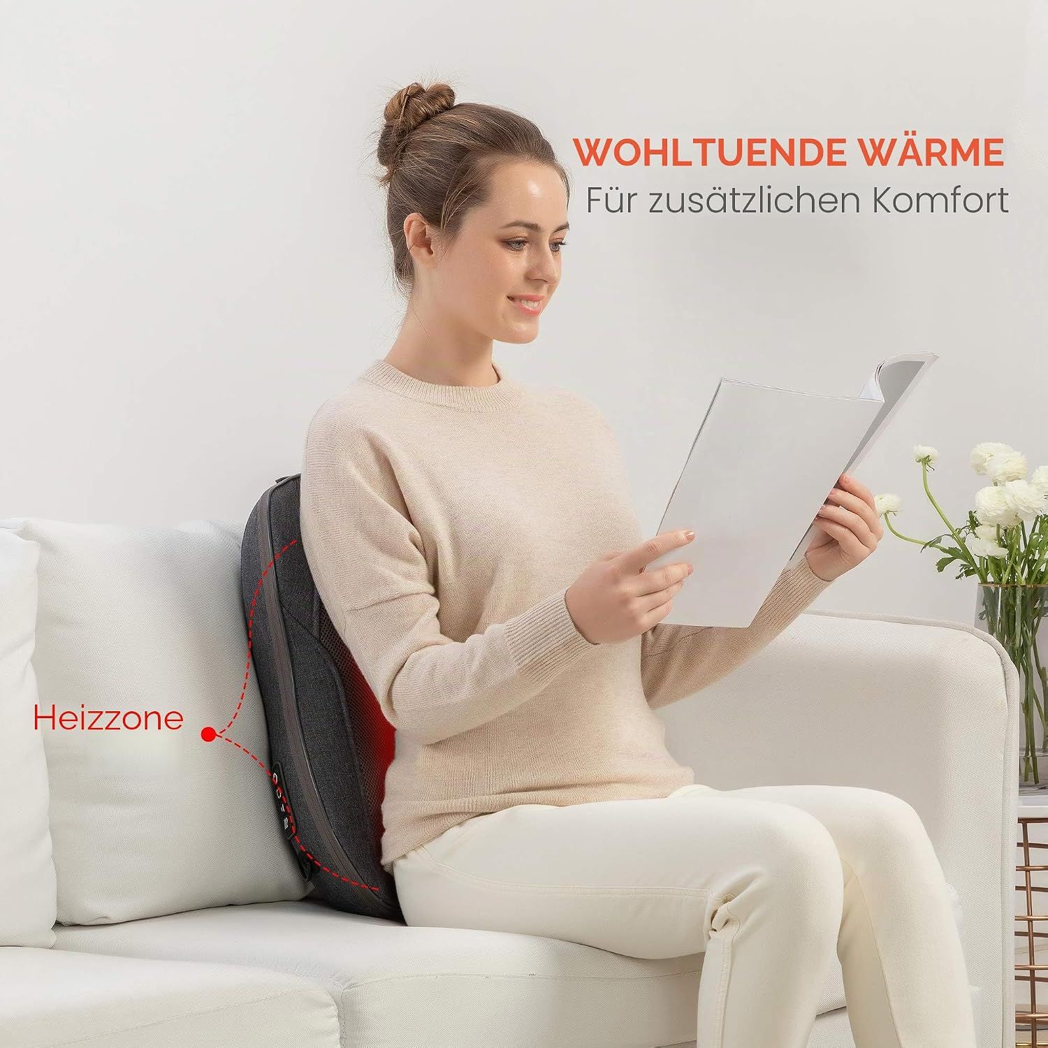 Graues Massagekissen mit roten Massageknoten und Heizfunktion.