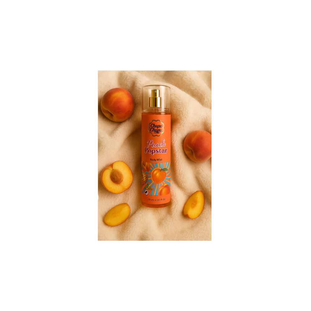 Körpernebel mit Pfirsich-Popstar-Design. Orangefarbene Flasche mit Sprühkopf. Umgeben von Pfirsichen.