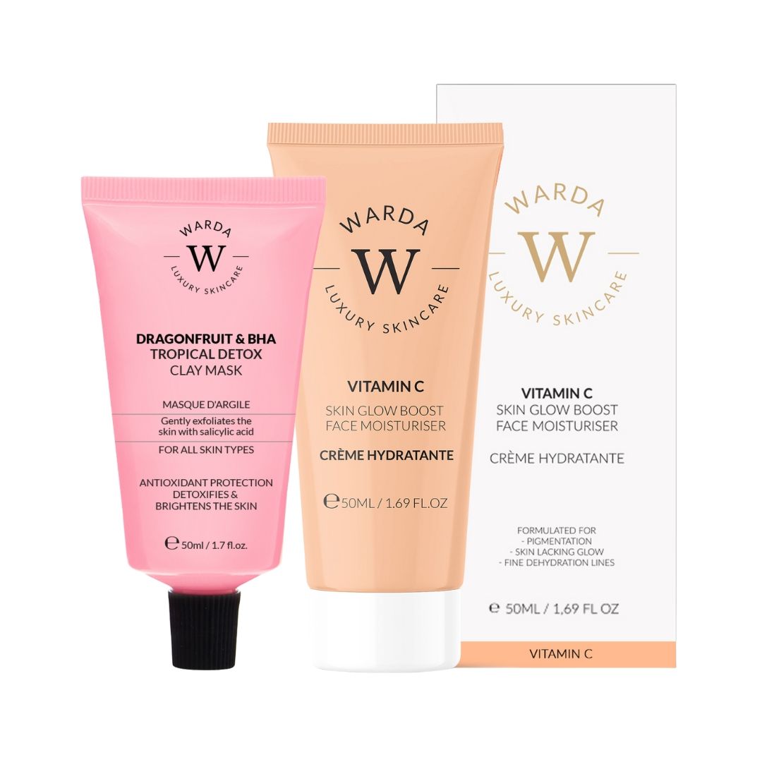 Rosa Tube mit schwarzem Verschluss, orangefarbene Tube, weiße Schachtel. Aufdruck: Warda Luxury Skincare, Vitamin C, Feuchtigkeitscreme.