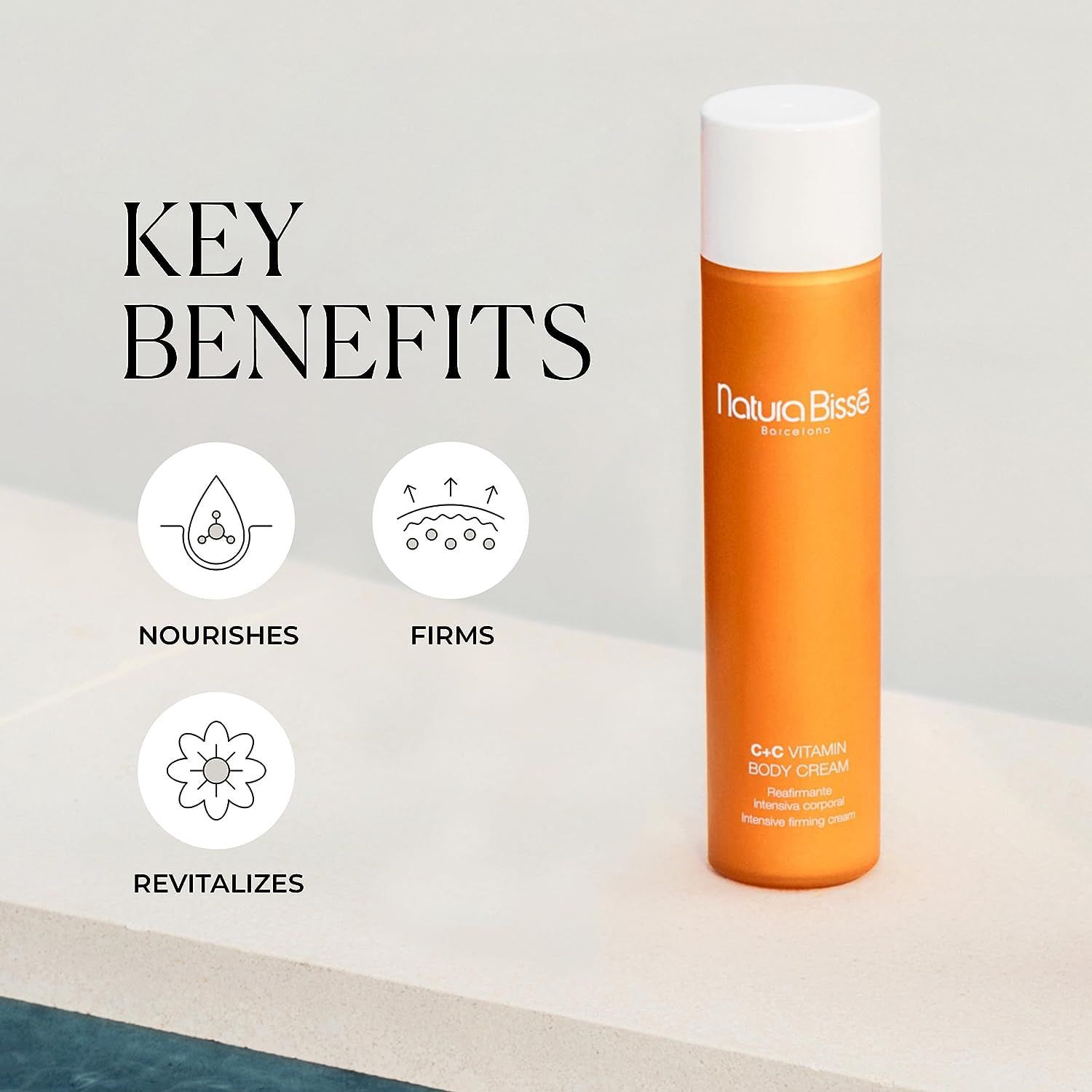 Orangefarbene Körpercreme-Tube mit weißem Deckel. Text: Natura Bissé, C+C Vitamin Body Cream. Icons: Nourishes, Firms, Revitalizes.