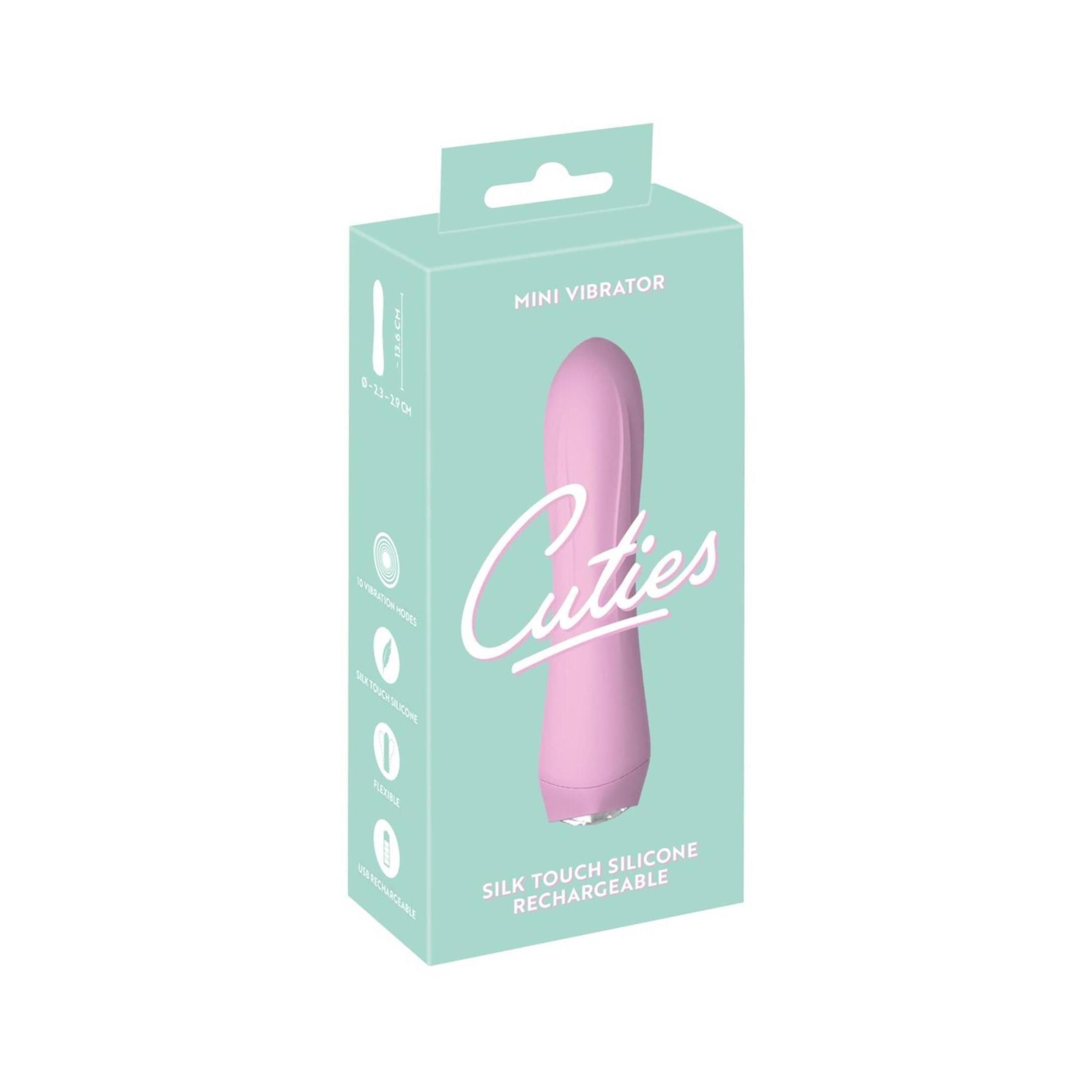 Rosa Mini-Vibrator in Verpackung. Aufschrift: Cuties, Mini Vibrator, Silk Touch Silicone, Rechargeable.