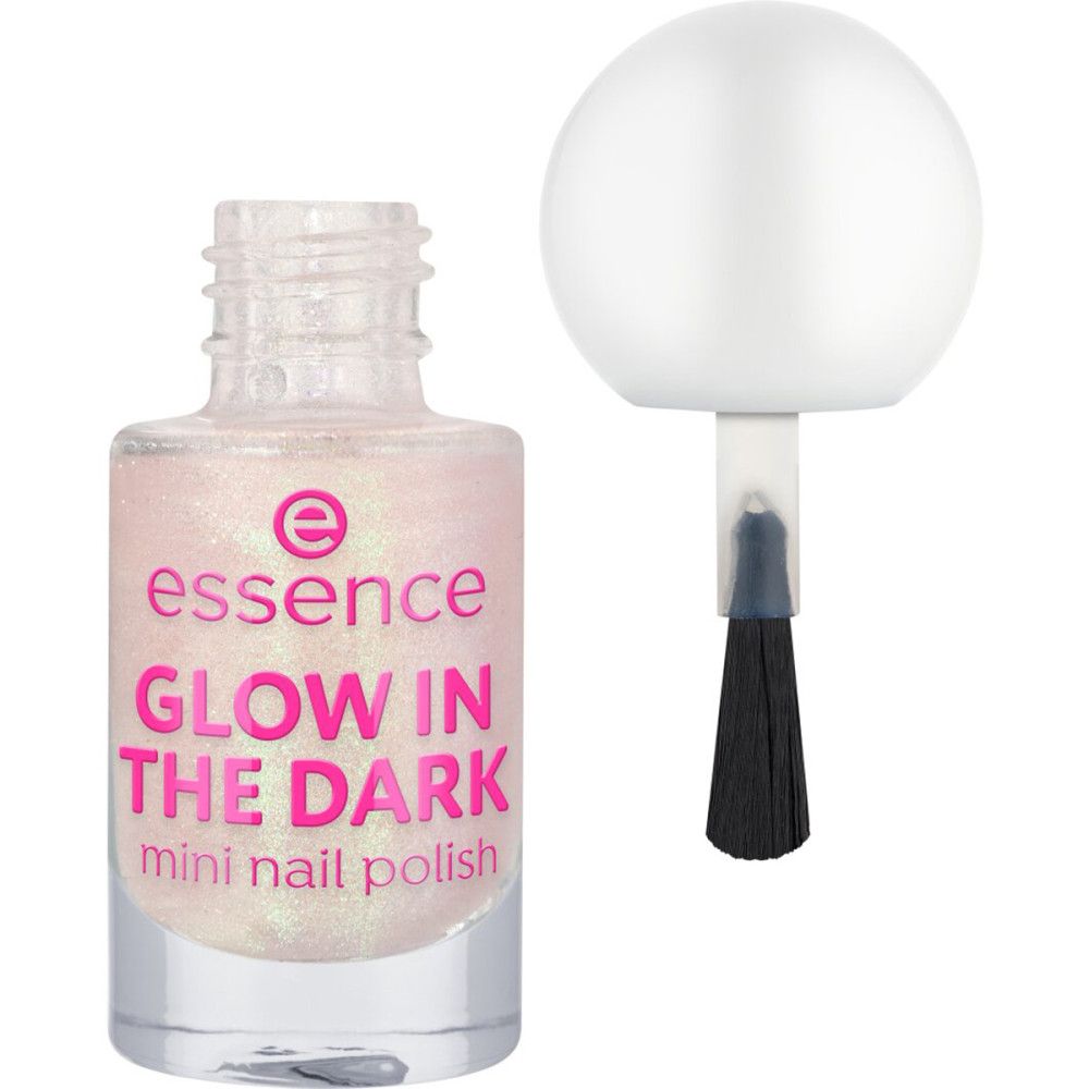 Essence Mini-Nagellack. Flasche mit rosa Etikett, Schriftzug 'GLOW IN THE DARK'. Pinsel daneben.