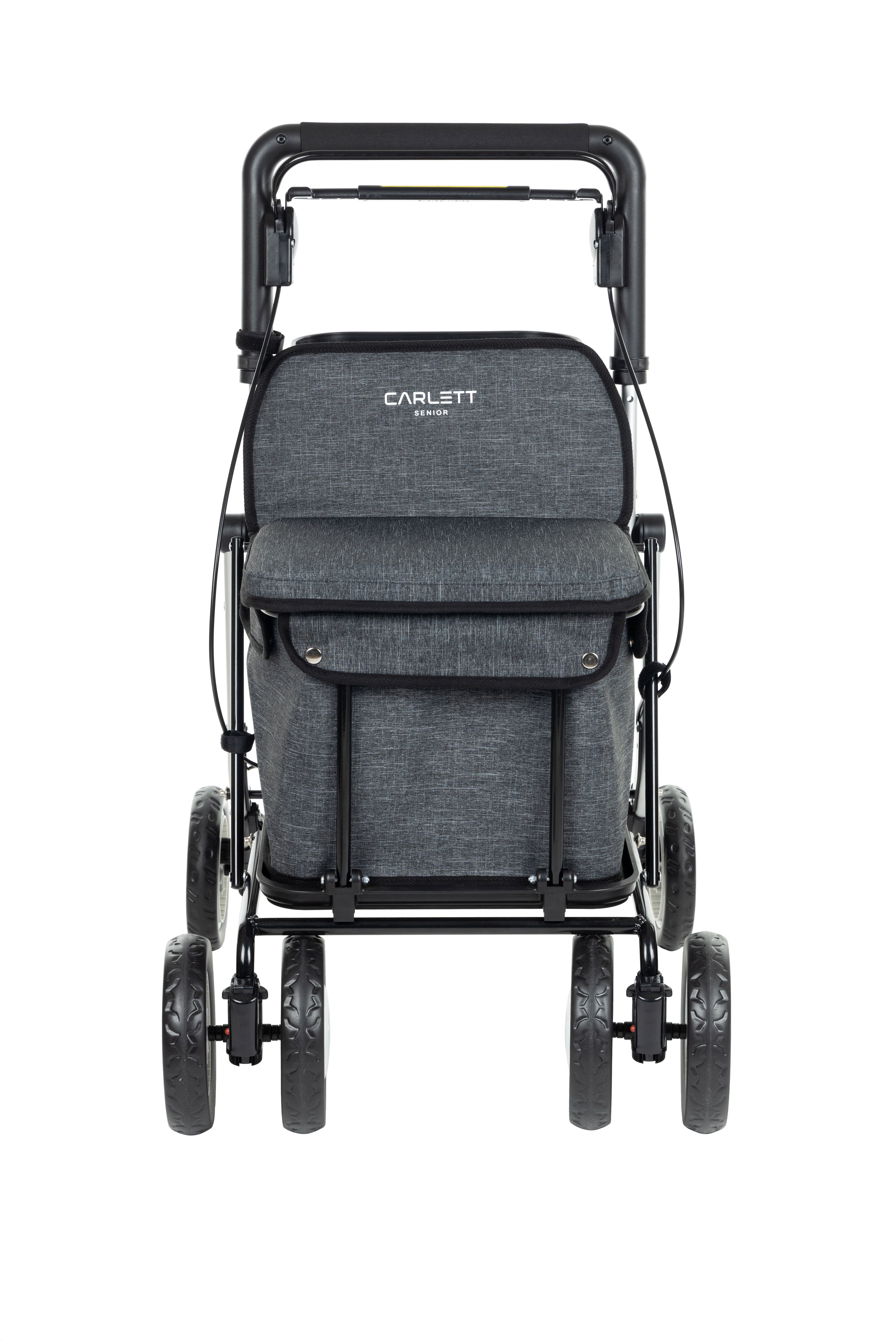 Carlett Assist Gehwagen, grau, mit schwarzem Rahmen und vier Rädern. Einkaufstasche und Sitz integriert.