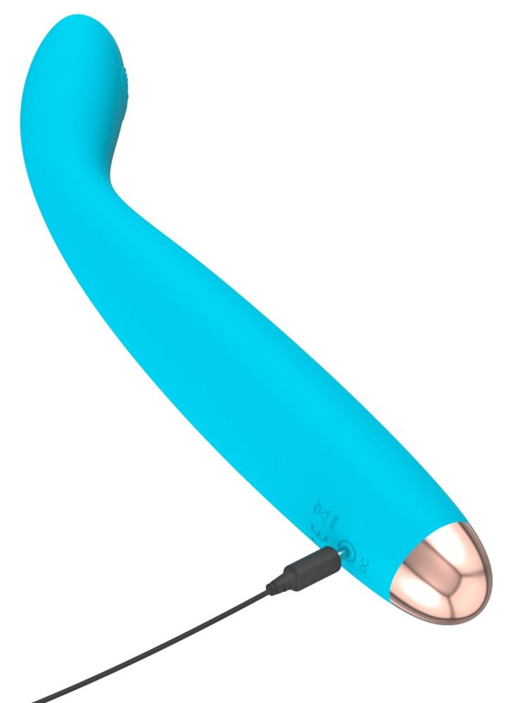 Hand hält blauen Taschenvibrator mit gebogener Spitze, Ladekabel angeschlossen.