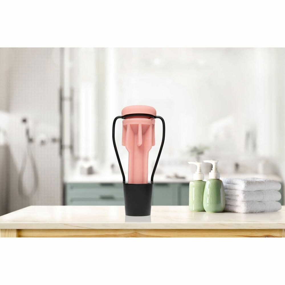 Rosa Produkt mit schwarzem Halter. Der Halter hat einen Griff. Das Produkt hat eine zylindrische Form.