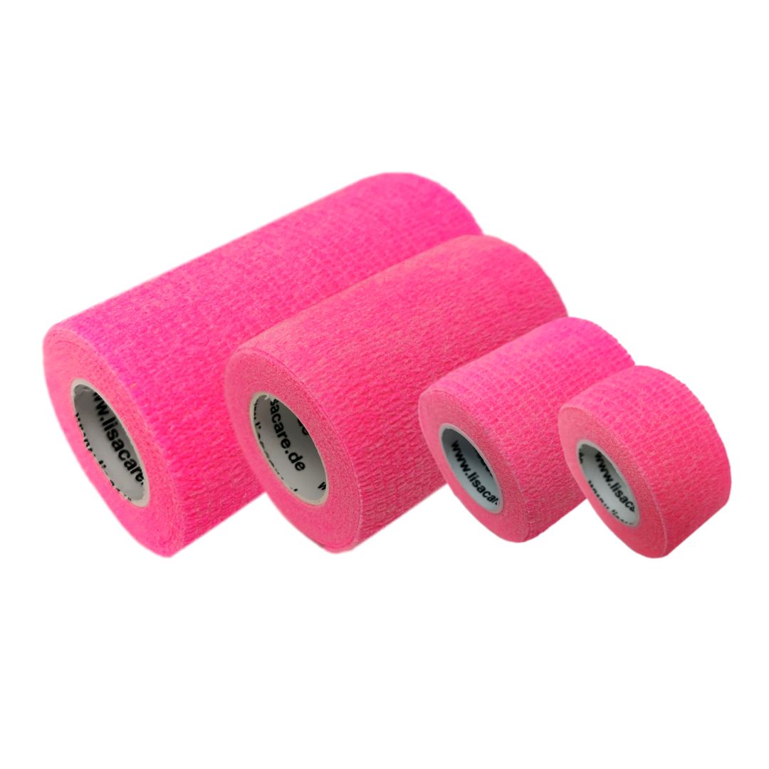 Vier selbstklebende Pflasterbandagen in Neonpink, verschiedene Breiten, aufgerollt.