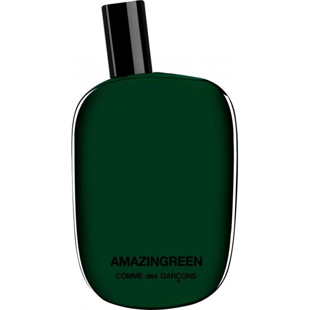 Grüne Glasflasche mit schwarzem Verschluss. "AMAZINGREEN COMME des GARÇONS" auf der Vorderseite.