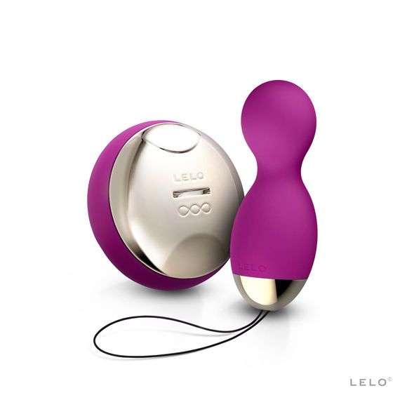 Schwarze Verpackung mit lila Vibrator und Fernbedienung. Text: LELO, HULA Beads.