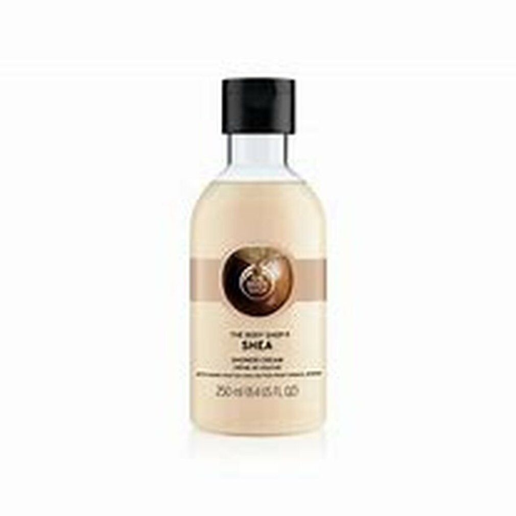 Flasche Duschcreme mit Etikett. Produktname und Logo sichtbar. Braunes Band mit Logo. 250 ml.