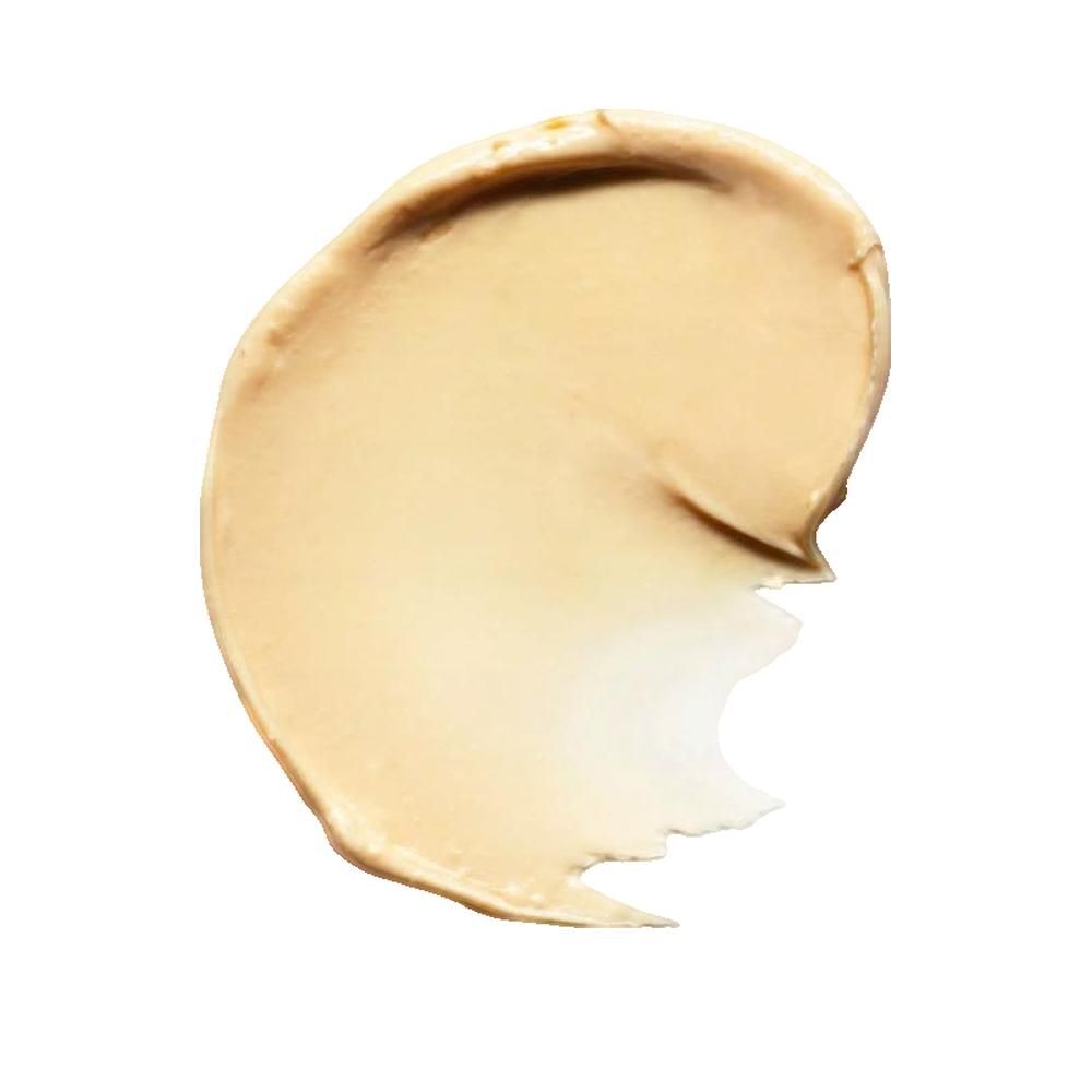 Heller, cremefarbener Lippenbalsam-Abstrich. Die Textur ist glatt und cremig. Der Abstrich ist auf weißem Hintergrund.