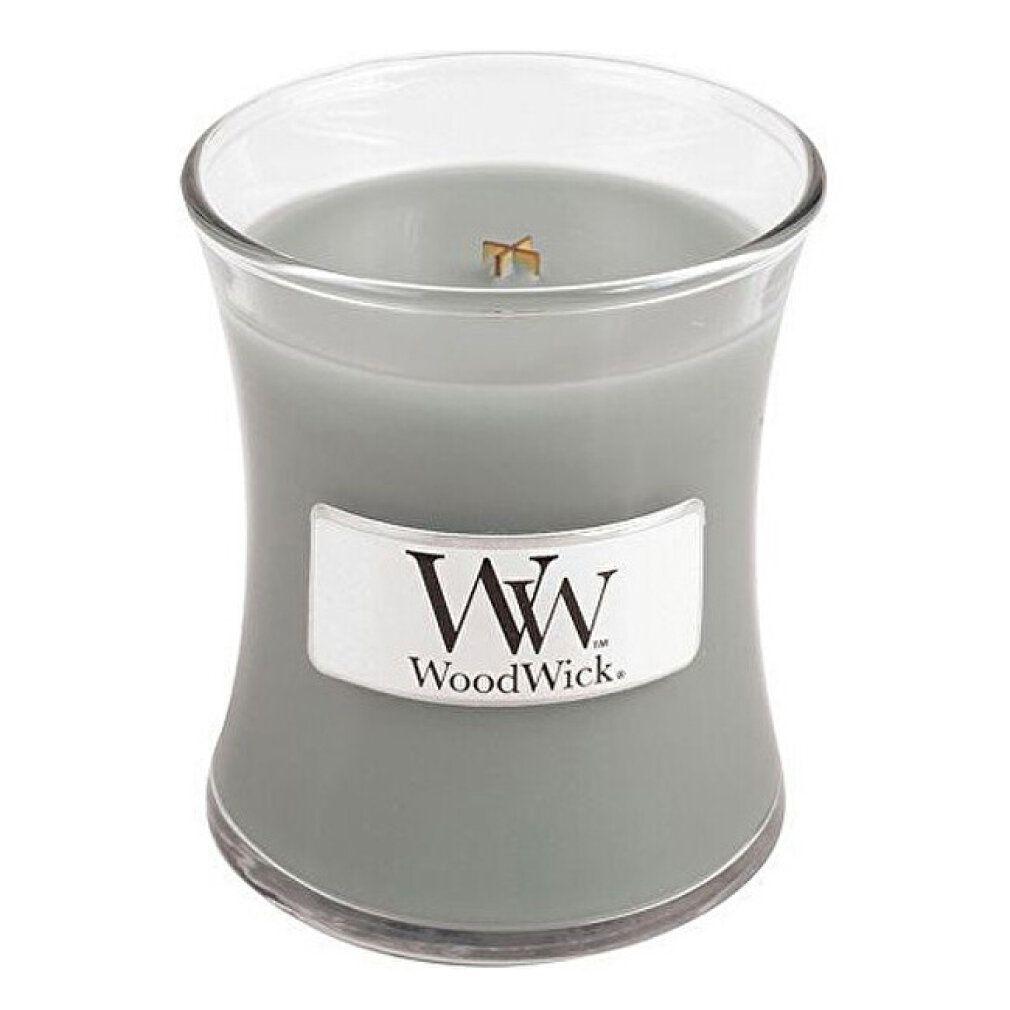 Kerze in Sanduhrform. Graues Wachs, Label mit WoodWick. Glasbehälter. Holzdocht sichtbar.