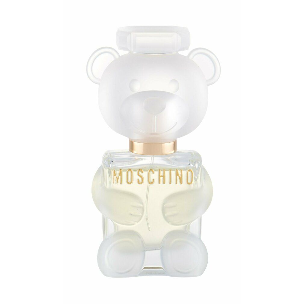 Parfümflakon in Teddybärform. Durchsichtiges Design mit goldfarbenem Halsband. Aufschrift: MOSCHINO.