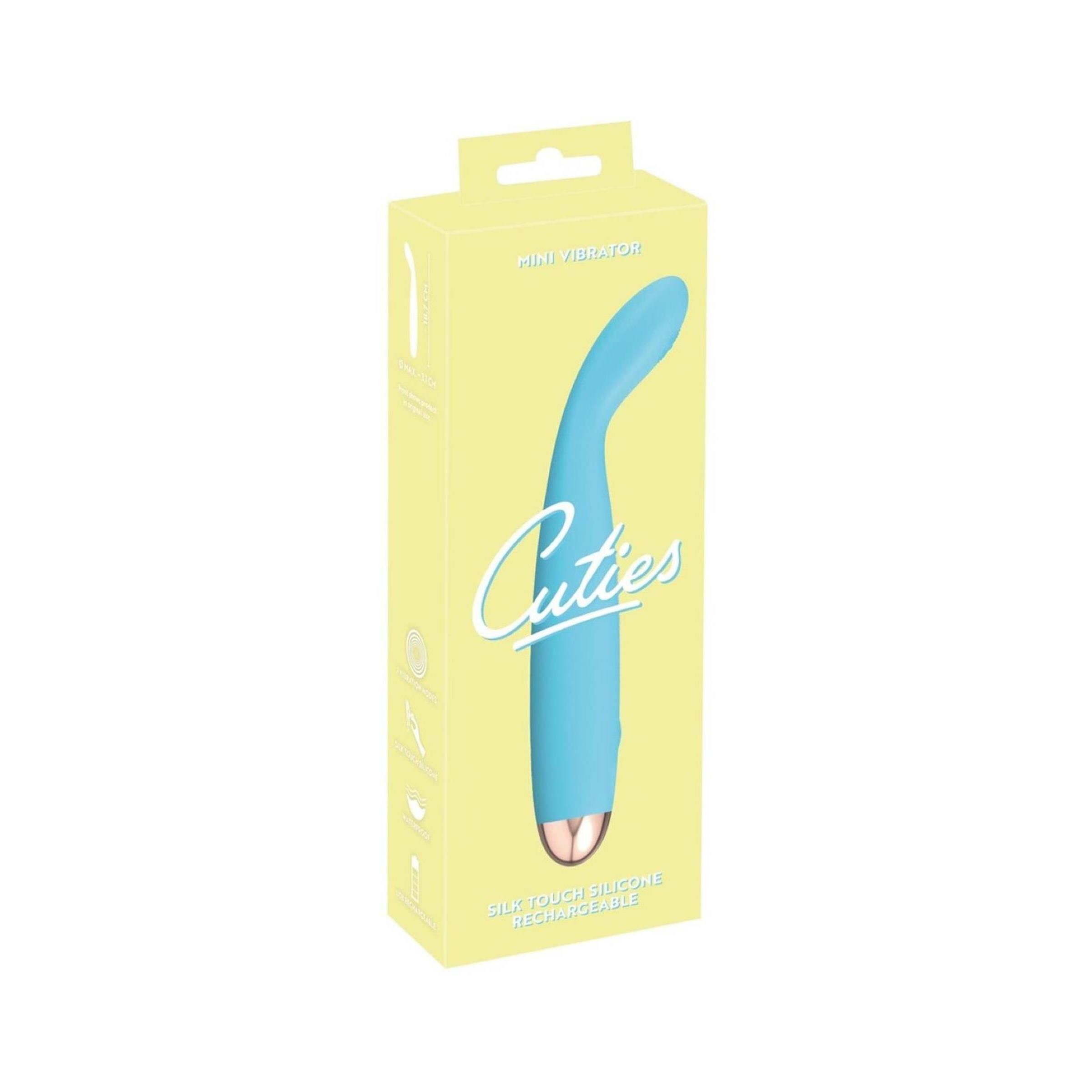 Verpackung mit türkisfarbenem Vibrator. Auf der Verpackung steht 'Cuties'.