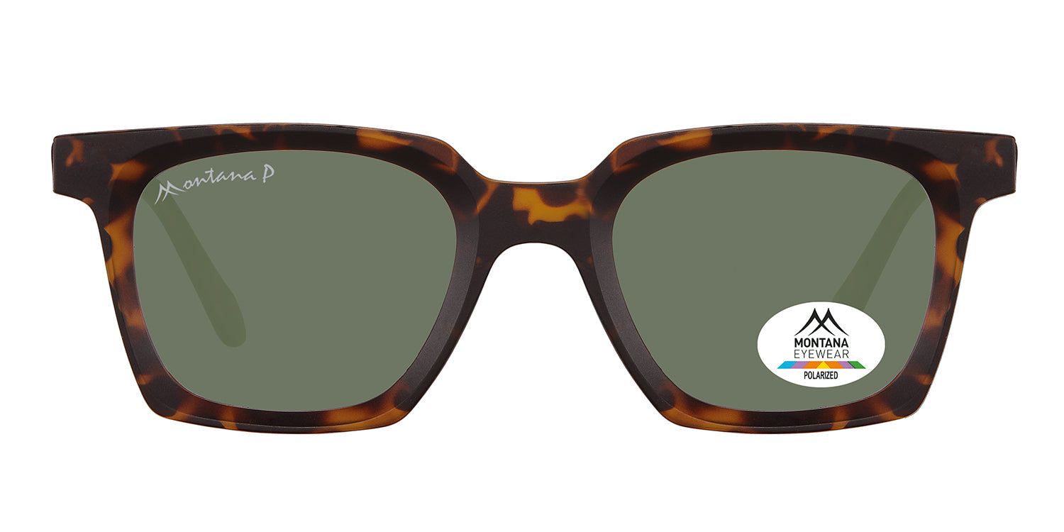 Sonnenbrille mit braunem Rahmen und grünen Gläsern. Auf einem Glas befindet sich ein Aufkleber mit dem Logo von Montana Eyewear.