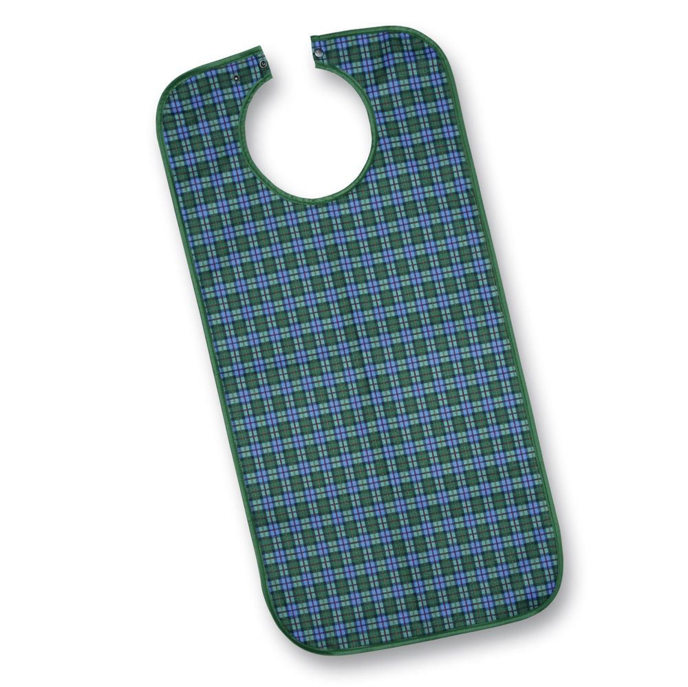 Grün-blau karierter Latz. Halsöffnung mit Druckknöpfen. Rechteckige Form mit abgerundeten Ecken. Aus Polyester.