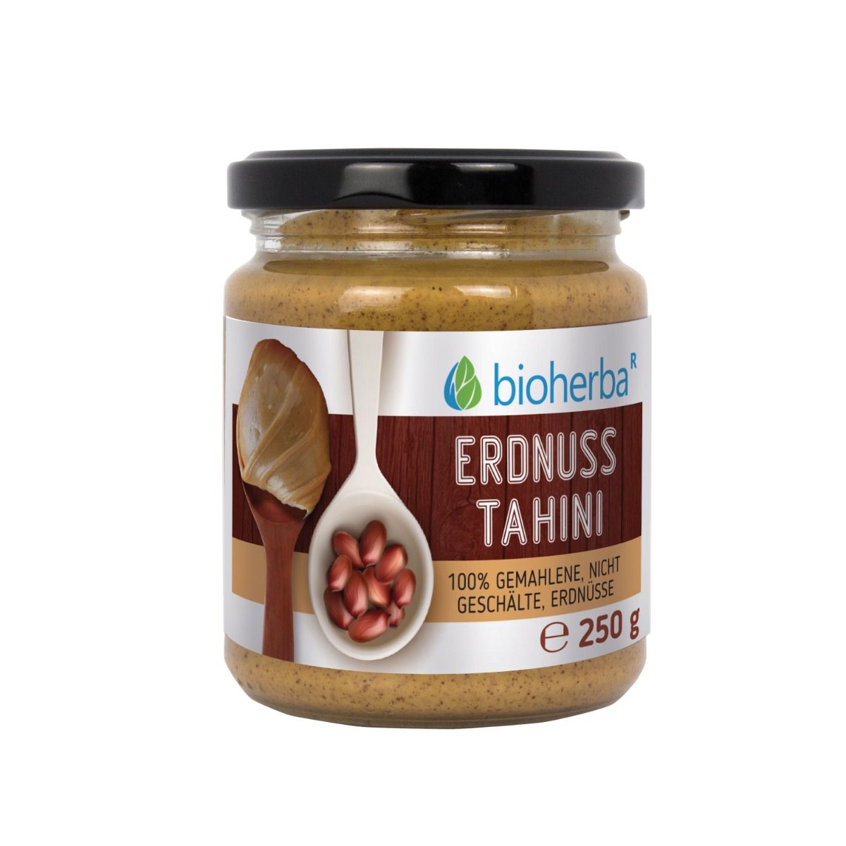 Glas mit Erdnuss-Tahini. Schwarzer Deckel. Etikett mit Produktname und Logo. 100% gemahlene, nicht geschälte Erdnüsse. 250g.