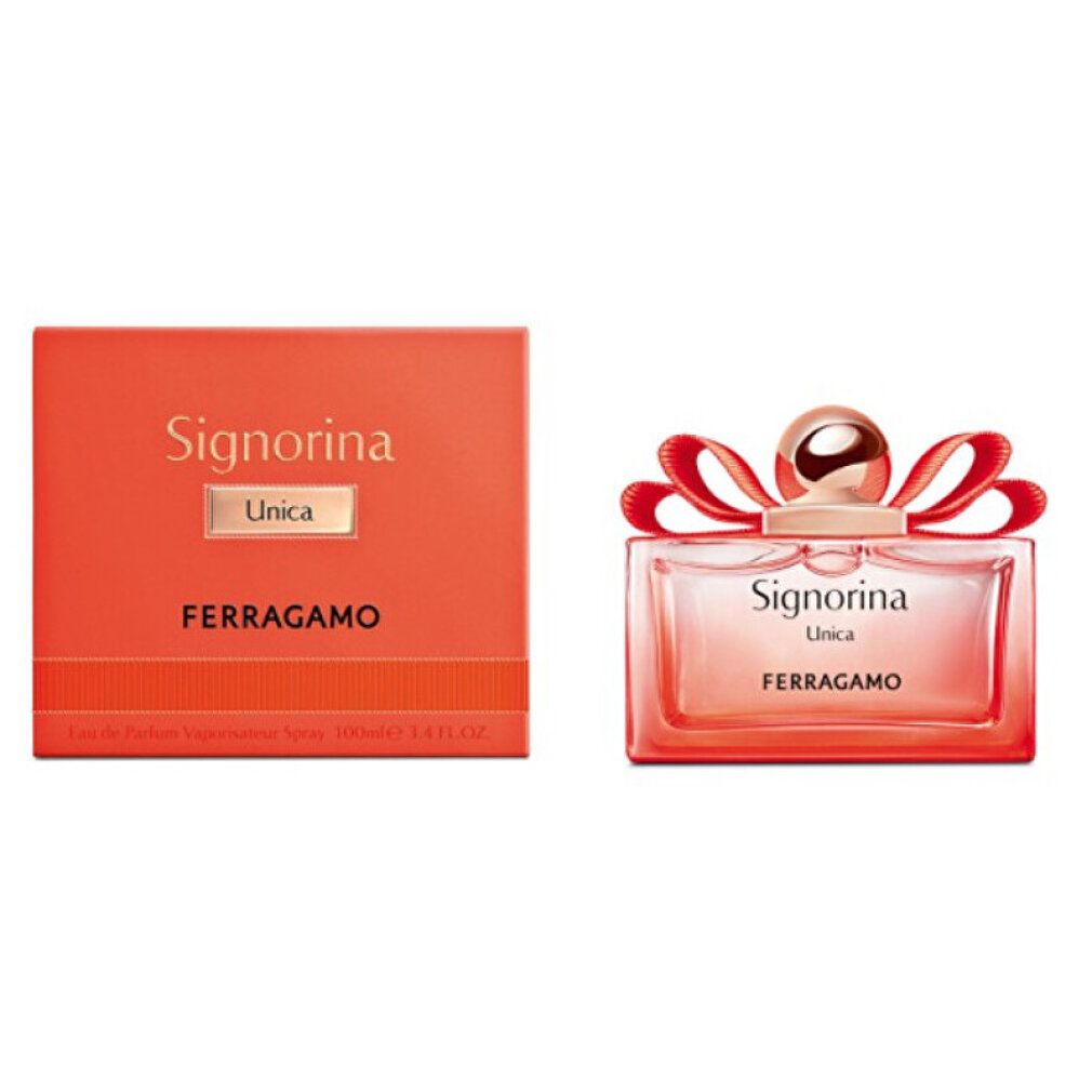 Orangefarbene Schachtel und Flakon. Flakon rechteckig, rosa mit goldfarbenem Verschluss und roter Schleife. Schriftzug Signorina Unica Ferragamo.