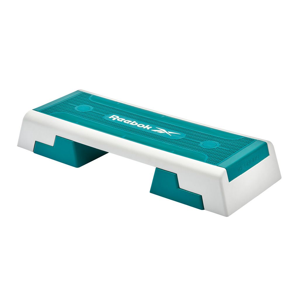 Reebok Step, teal und weiß. Rechteckige Form mit zwei Stützfüßen. Reebok Logo.