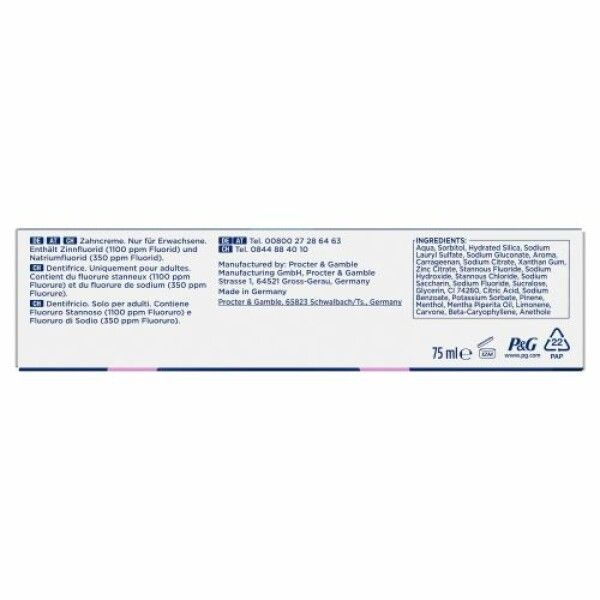 Zahncreme-Tube, weiß mit blauen und rosa Akzenten. Text: Inhaltsstoffe, 75 ml, P&G-Logo. Made in Germany.