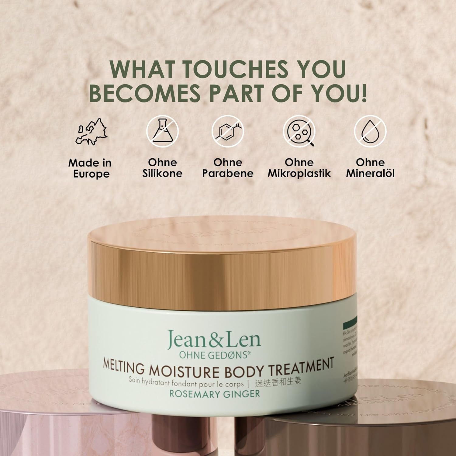 Produkt-Tiegel mit goldfarbenem Deckel. Aufschrift: Jean & Len, Melting Moisture Body Treatment Rosemary Ginger. Icons: Made in Europe, Ohne...