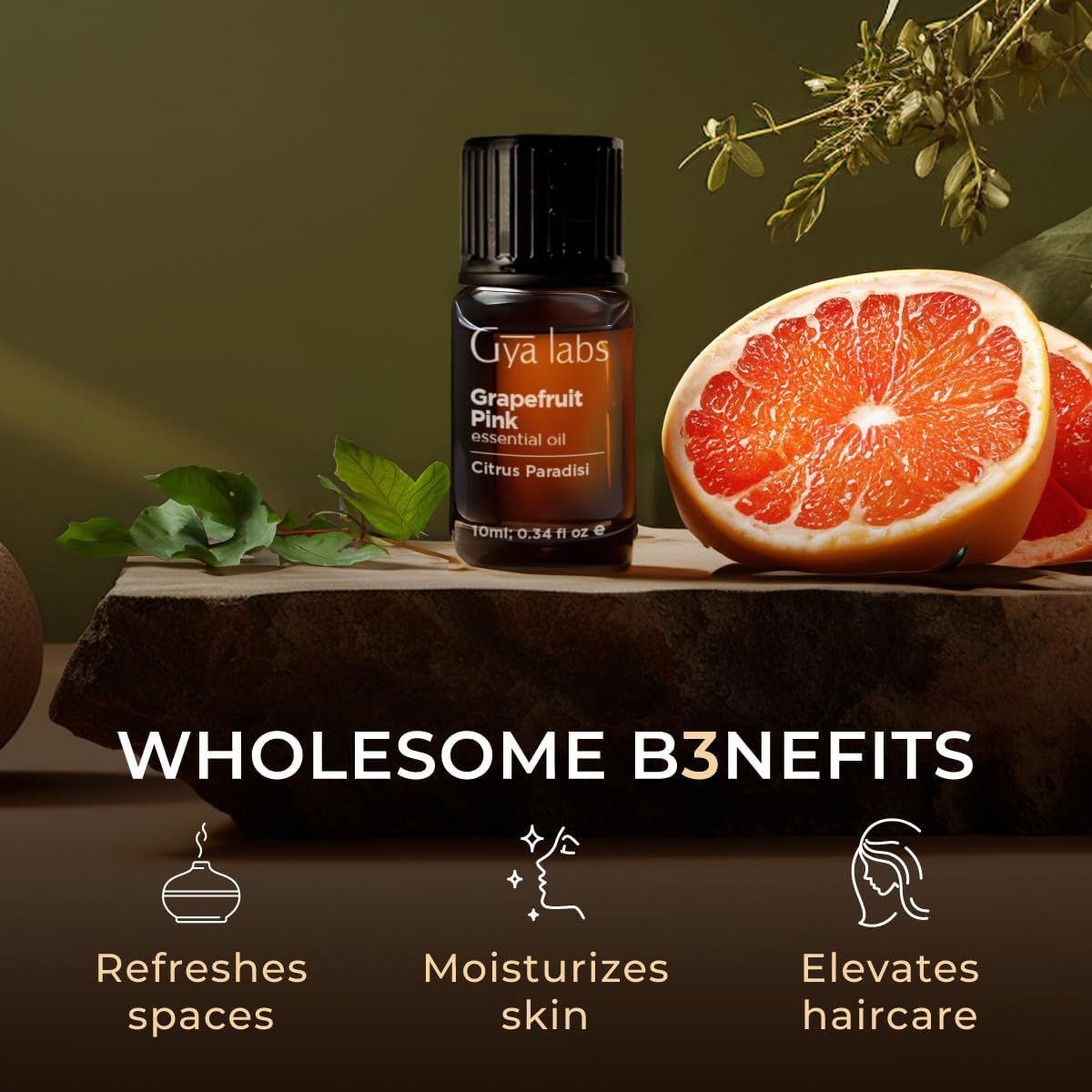 Braune Glasflasche mit Etikett, Grapefruit-Hälfte. Text: "Gya labs". Vorteile: Erfrischt Räume, befeuchtet Haut, verbessert Haarpflege.