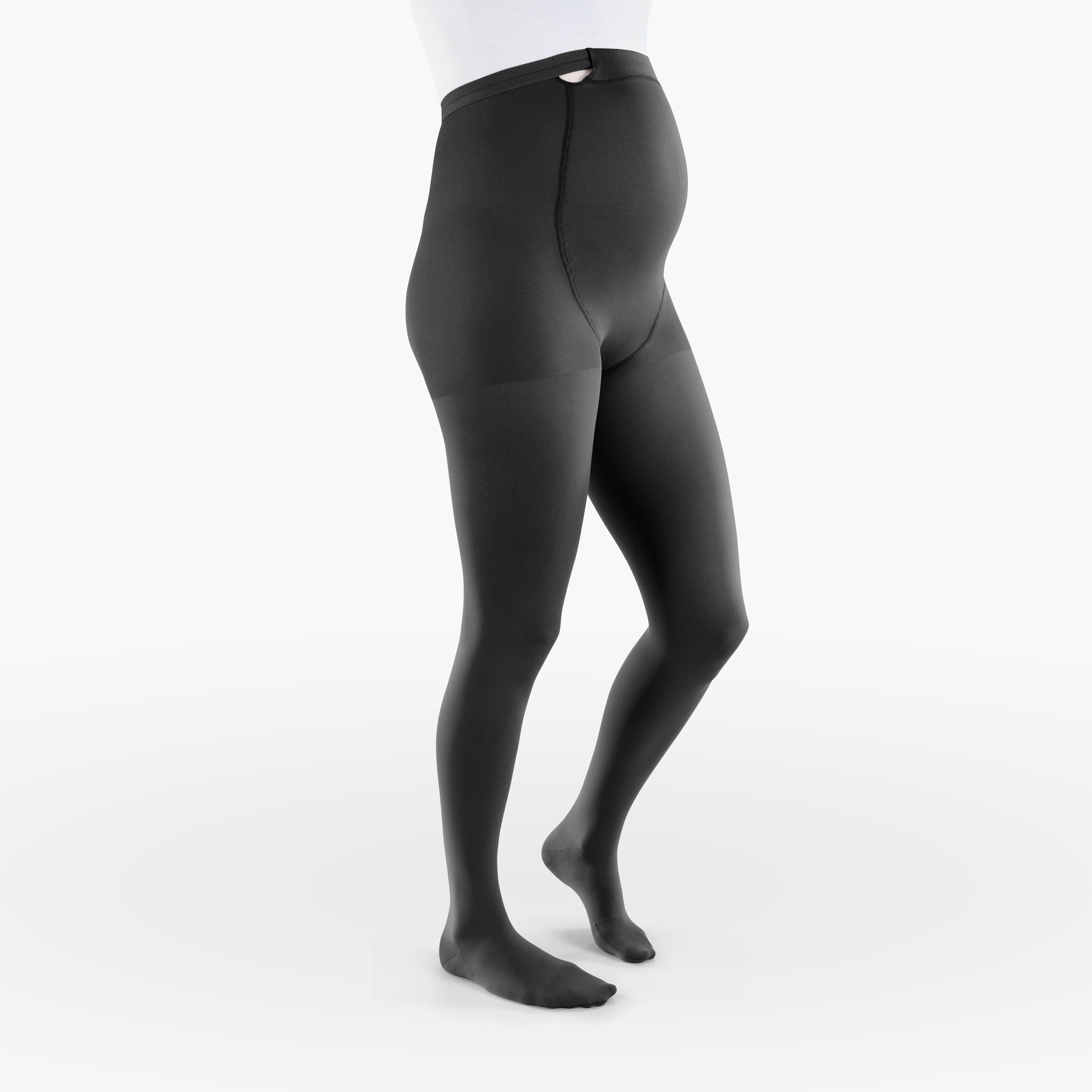 Schwarze Kompressionsstrumpfhose für Schwangere. Blick von der Seite, auf einem Körper getragen.