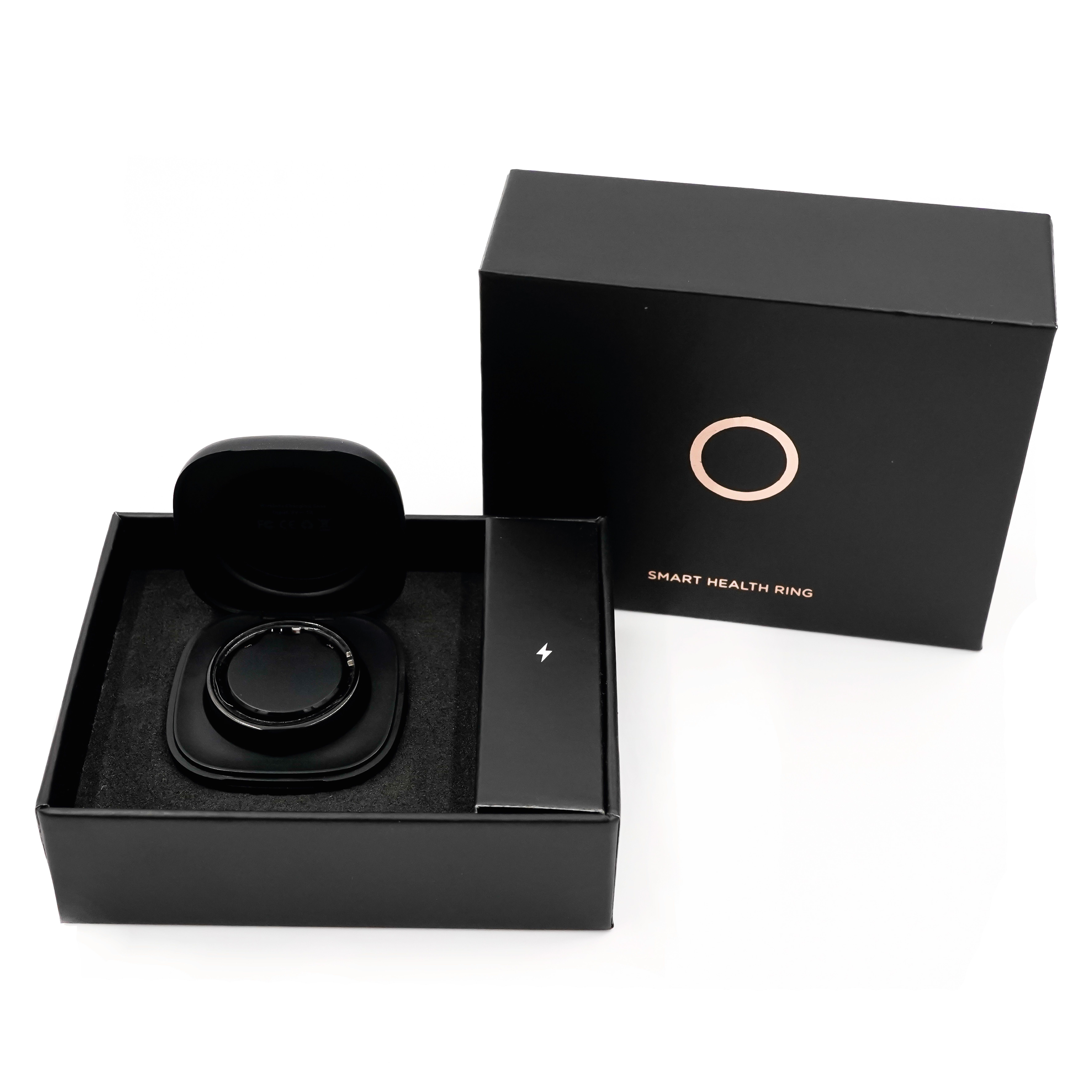 Schwarze Verpackung mit NEXTRING Smart Health Ring. Enthält Ring, Ladestation und Kabel.