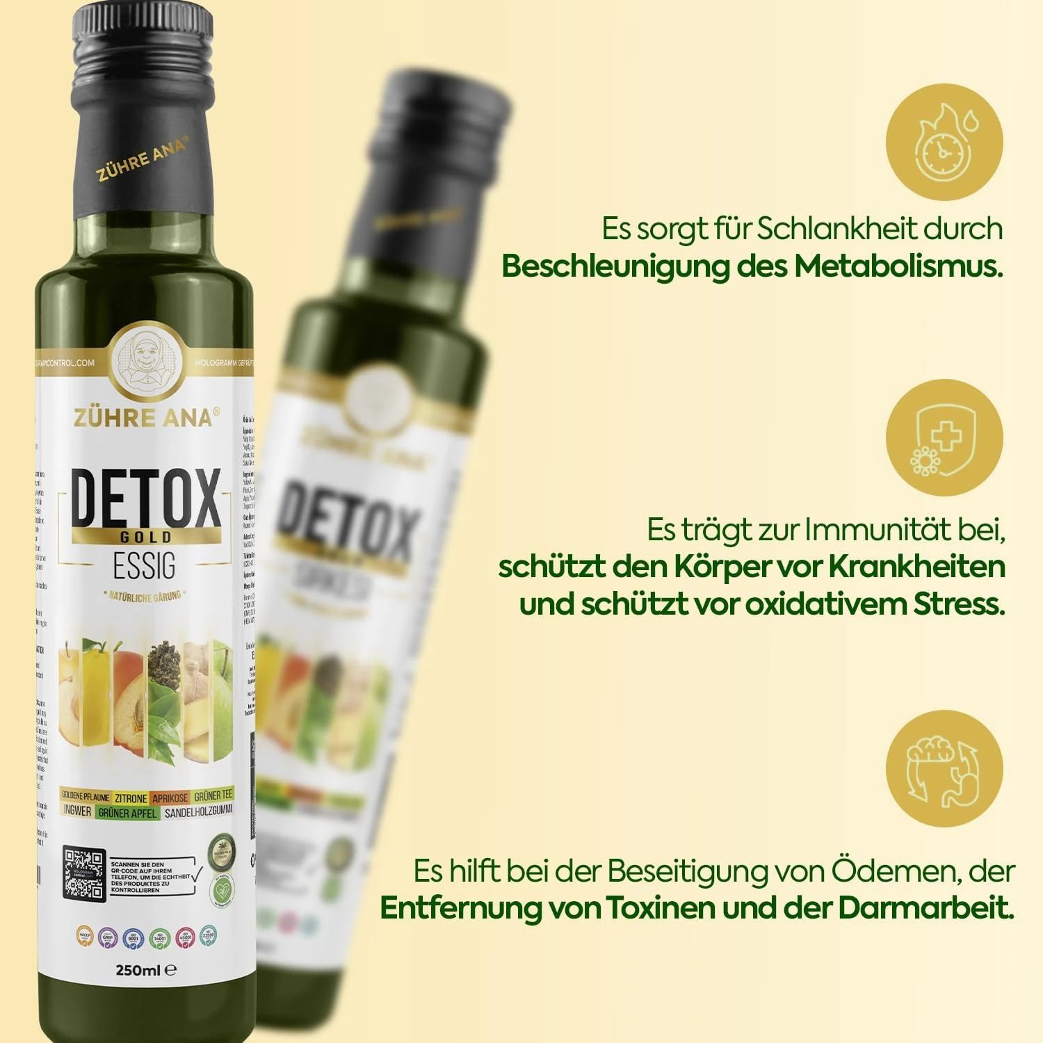 Zwei grüne Flaschen mit schwarzem Deckel. Aufschrift: Zühre Ana D-Tox Gold Essig. Text: Fördert Immunität, schützt vor Krankheiten.