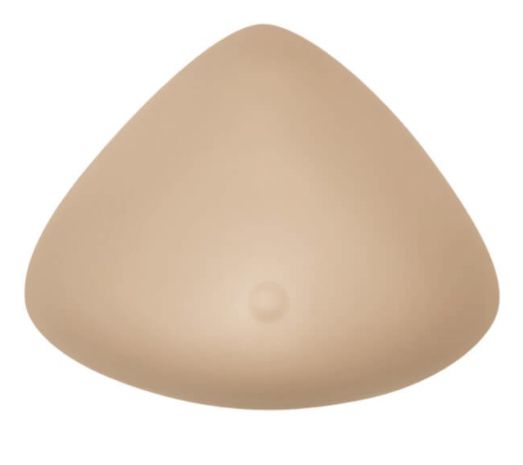 Brustprothese, beige, dreieckig. Mit einer kleinen, runden Erhebung in der Mitte.